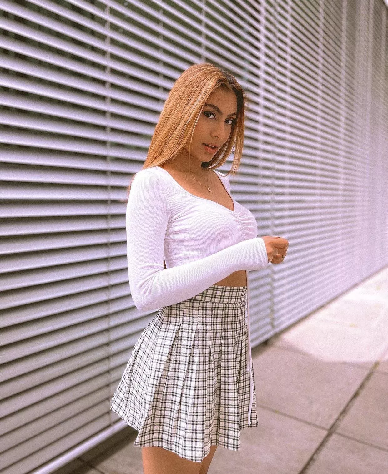 Innocent beauty in white top and skirt