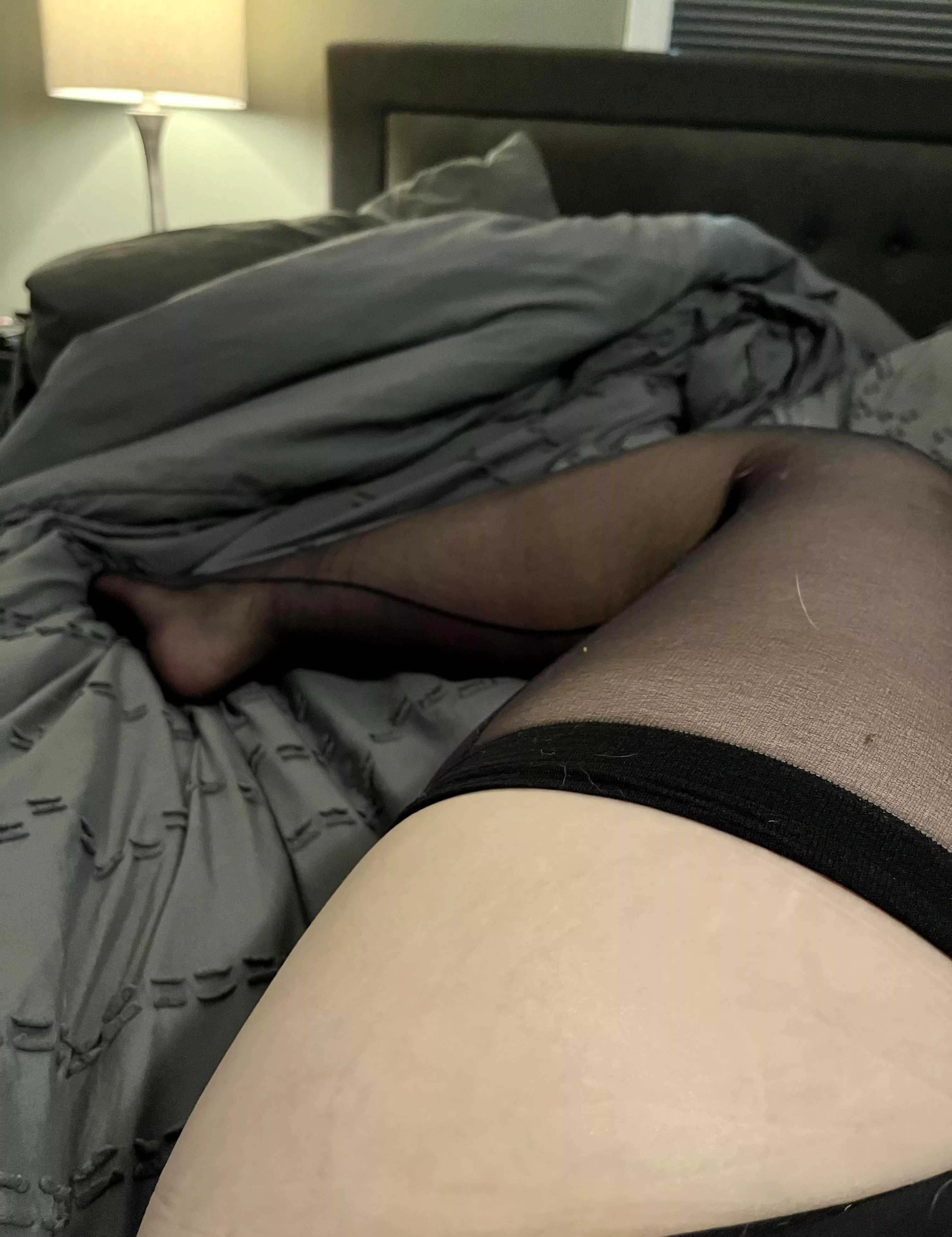 Curled up in bed in just tights and panties. ðŸ˜Š