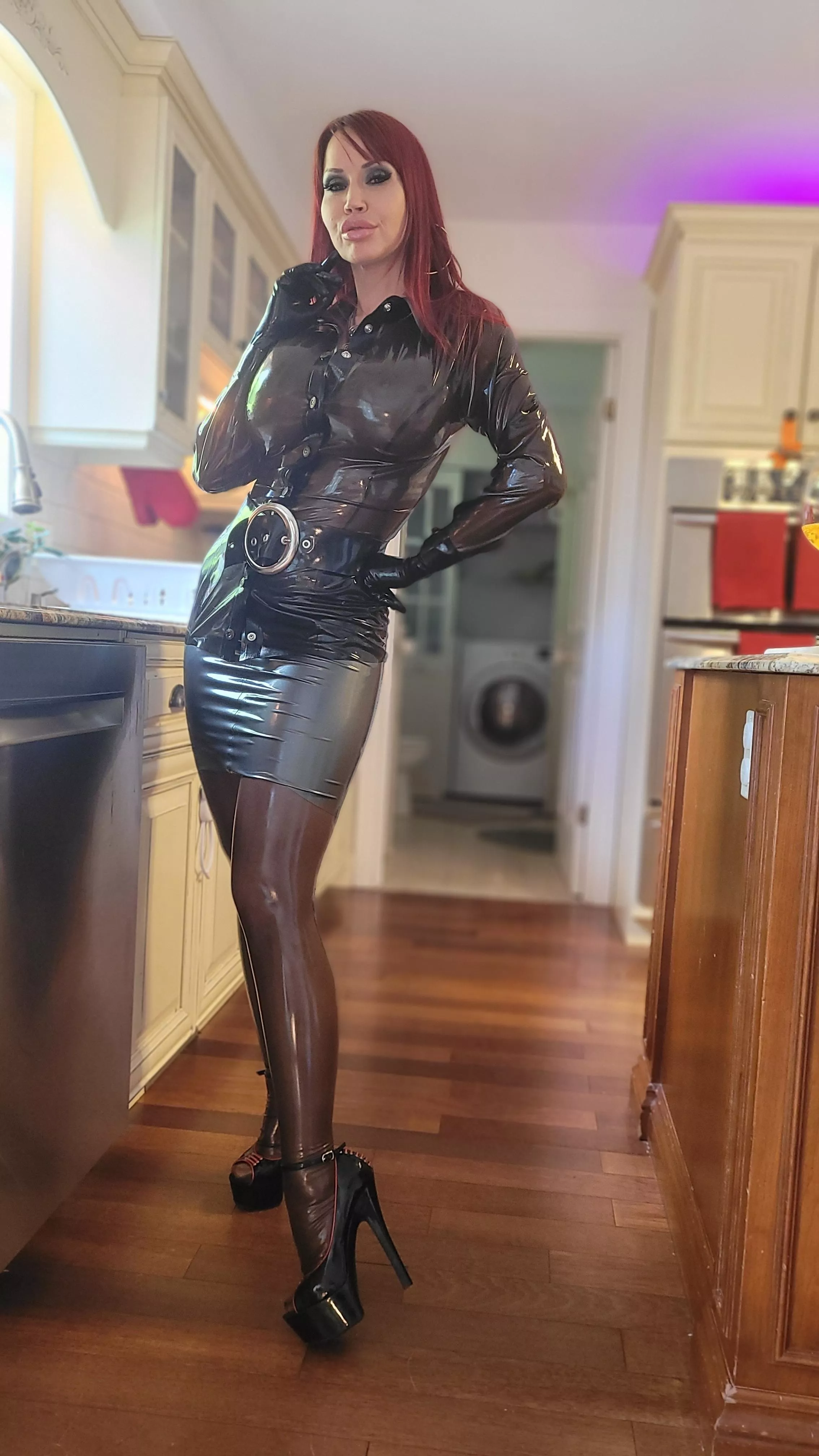 she's striking the pose in her fine latex ðŸ˜