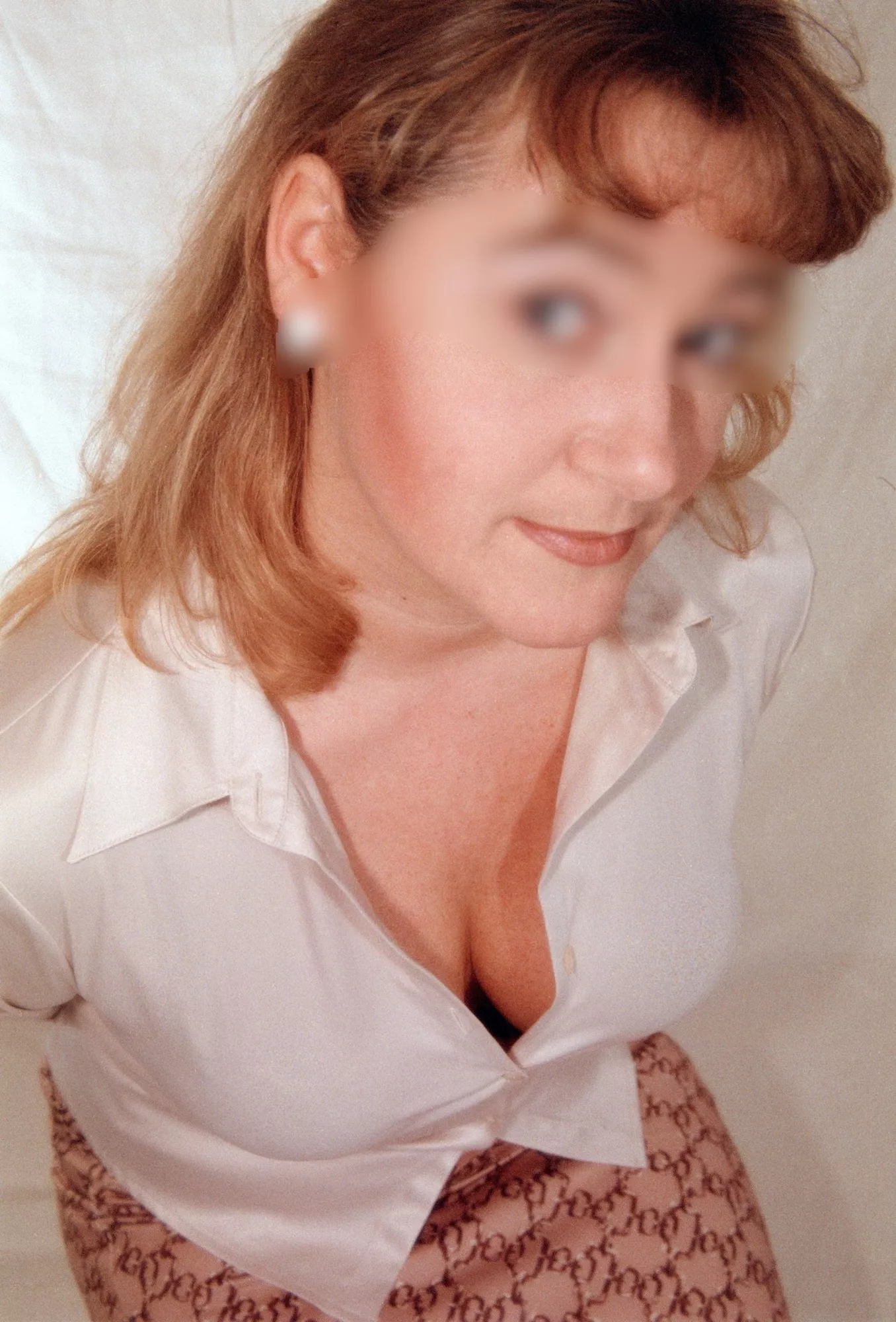 Teasing the colleagues with her cleavage and a tight Satin Blouse