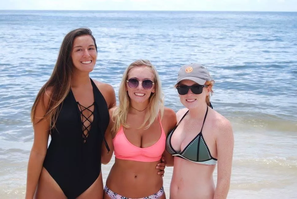 Tall brunette, tan blonde, and busty red head.