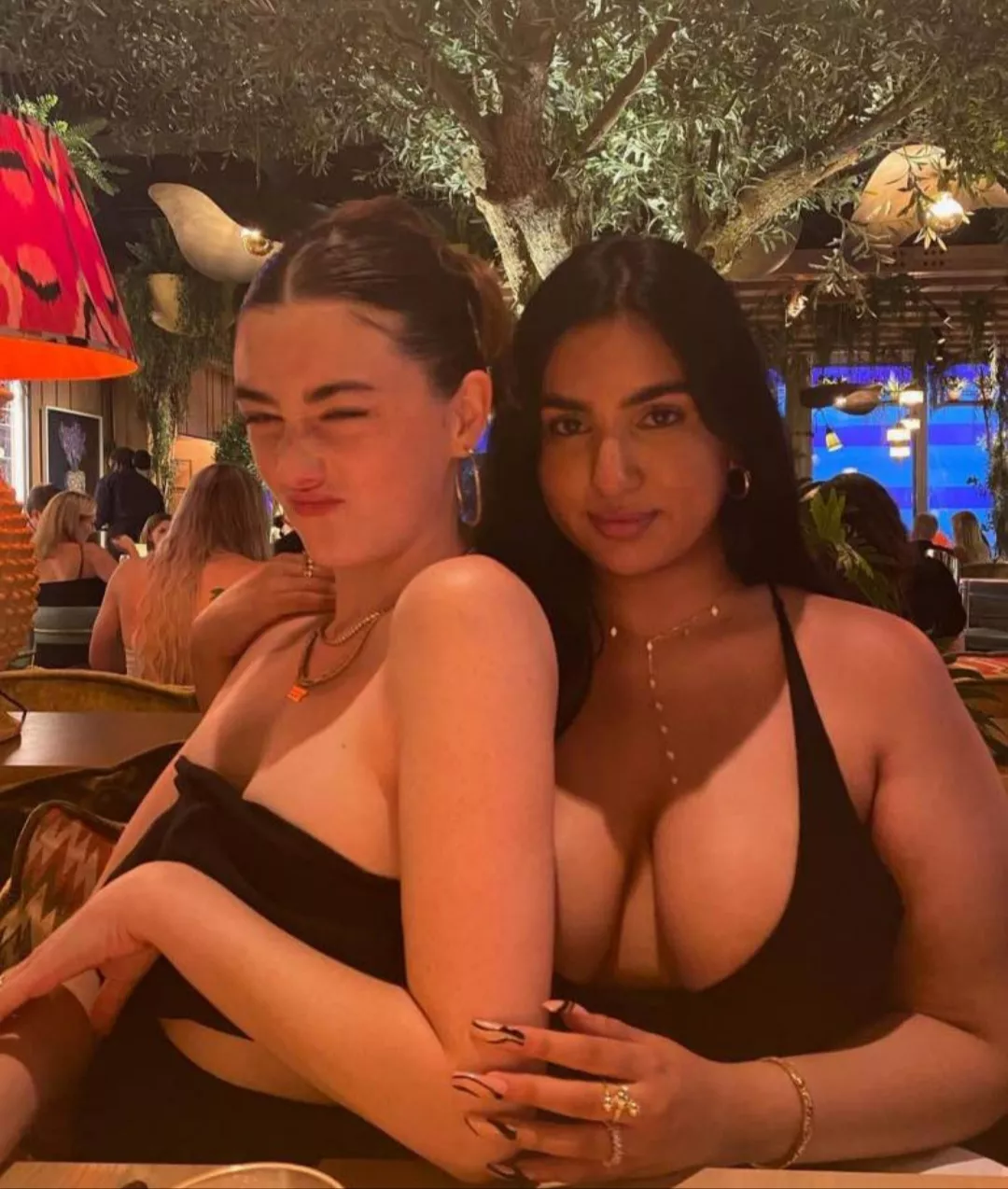 Kindly calming her bestie's breast envy.