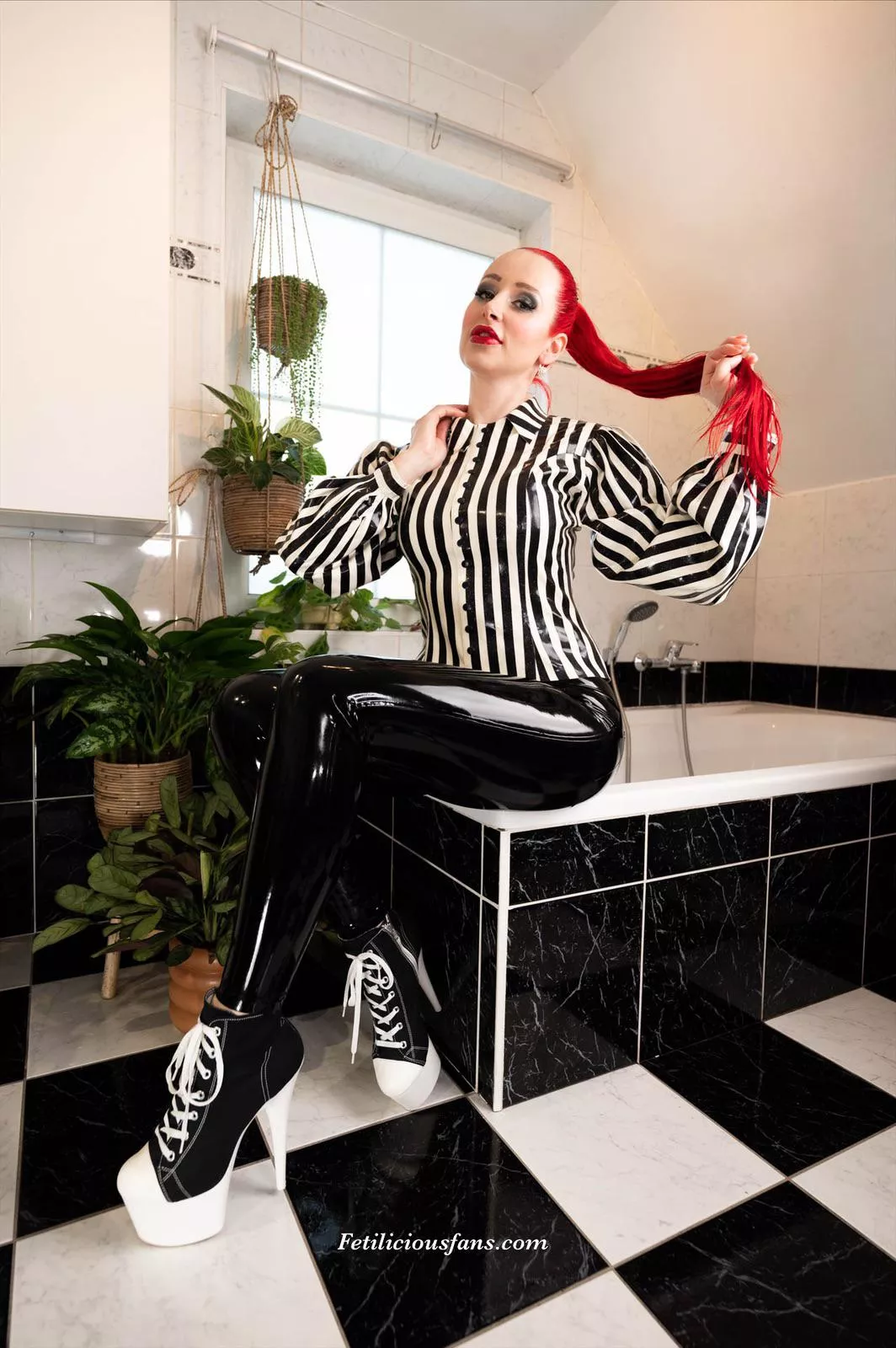 Just a regular day in my latex life. Wearing my black latex leggings and striped latex blouse