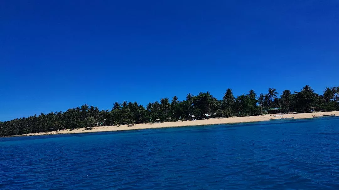 white sands and blue waters