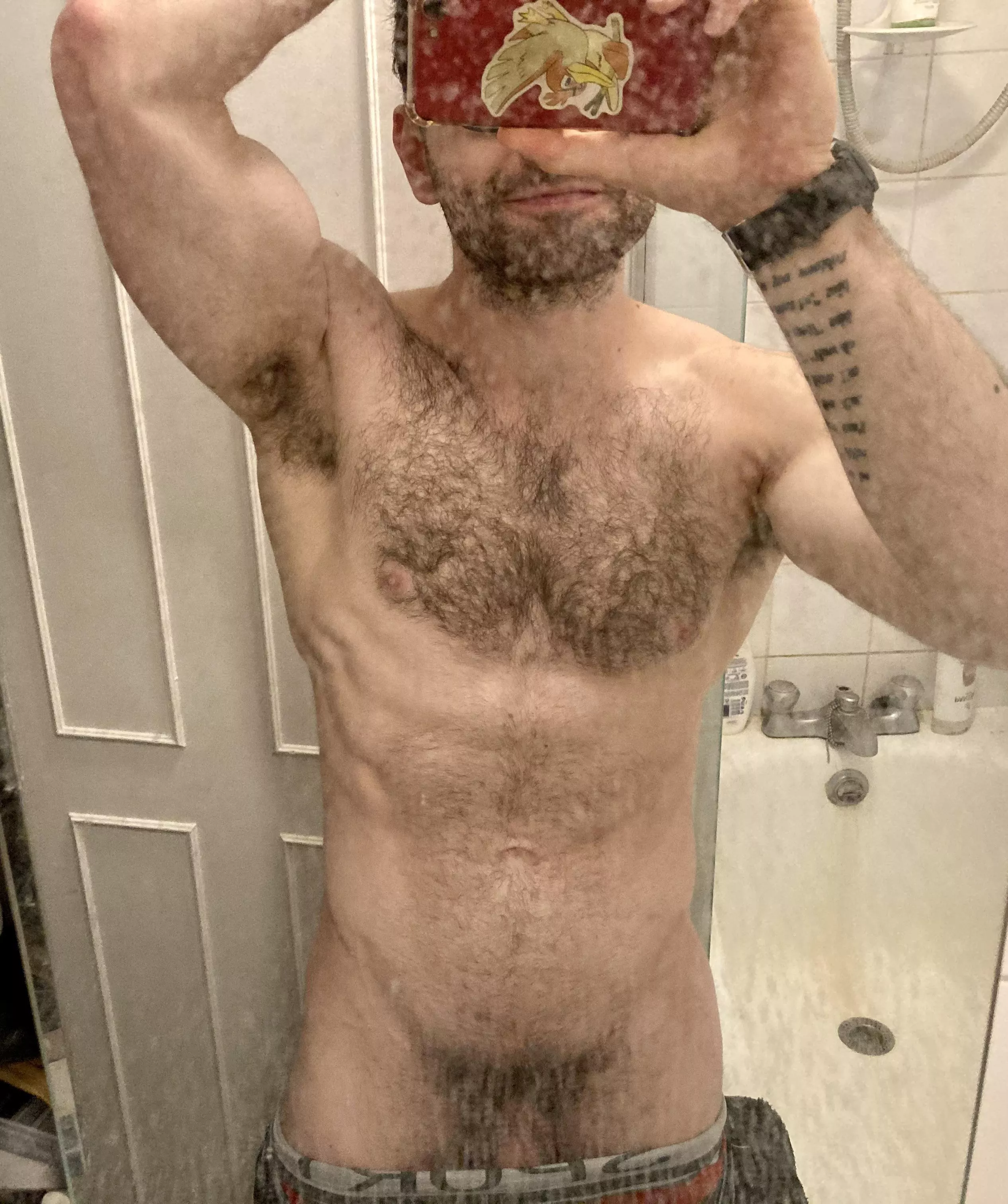 An utterly filthy bathroom mirror. An even filthier young man