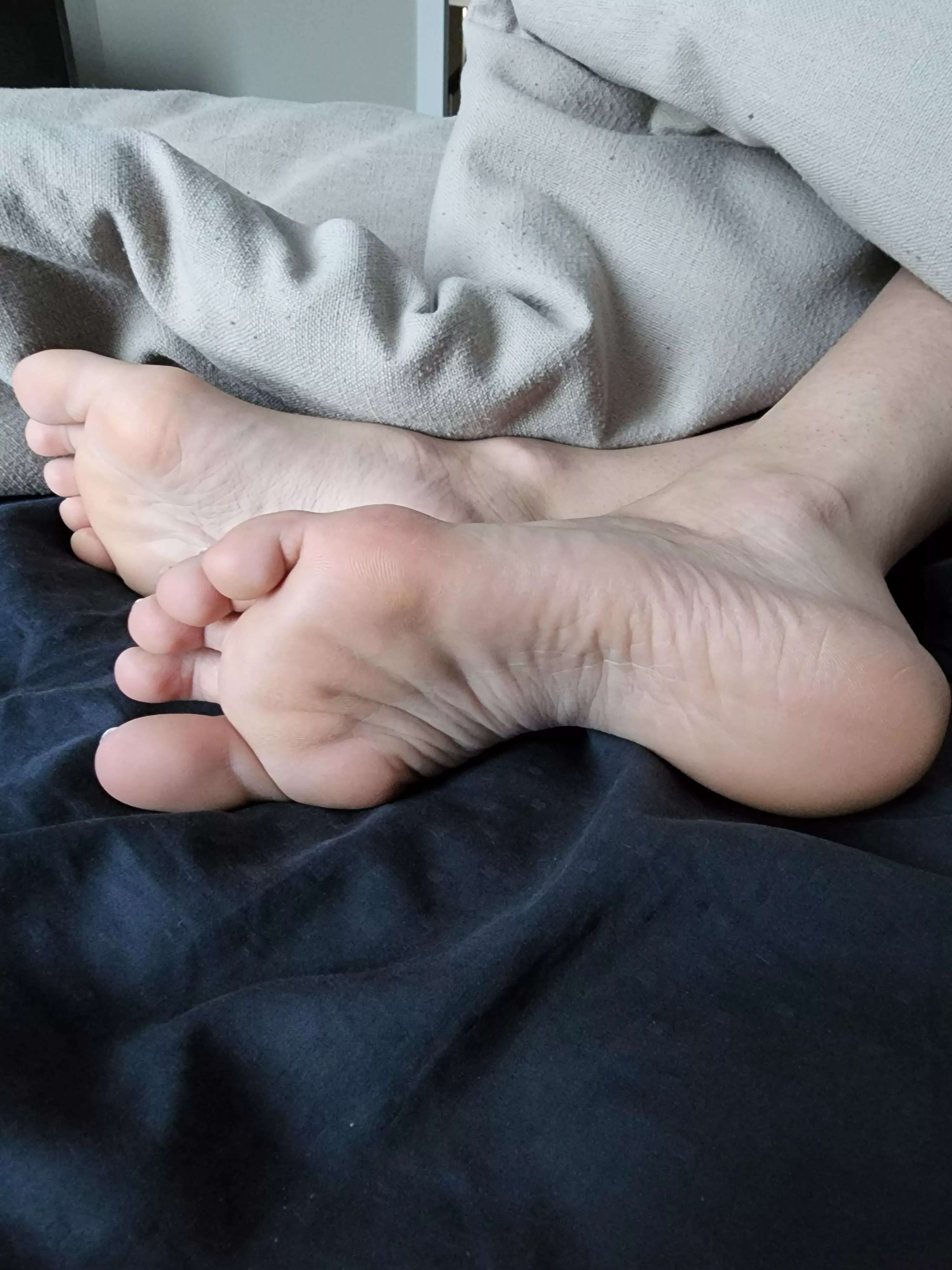 My little pink soles in the bed