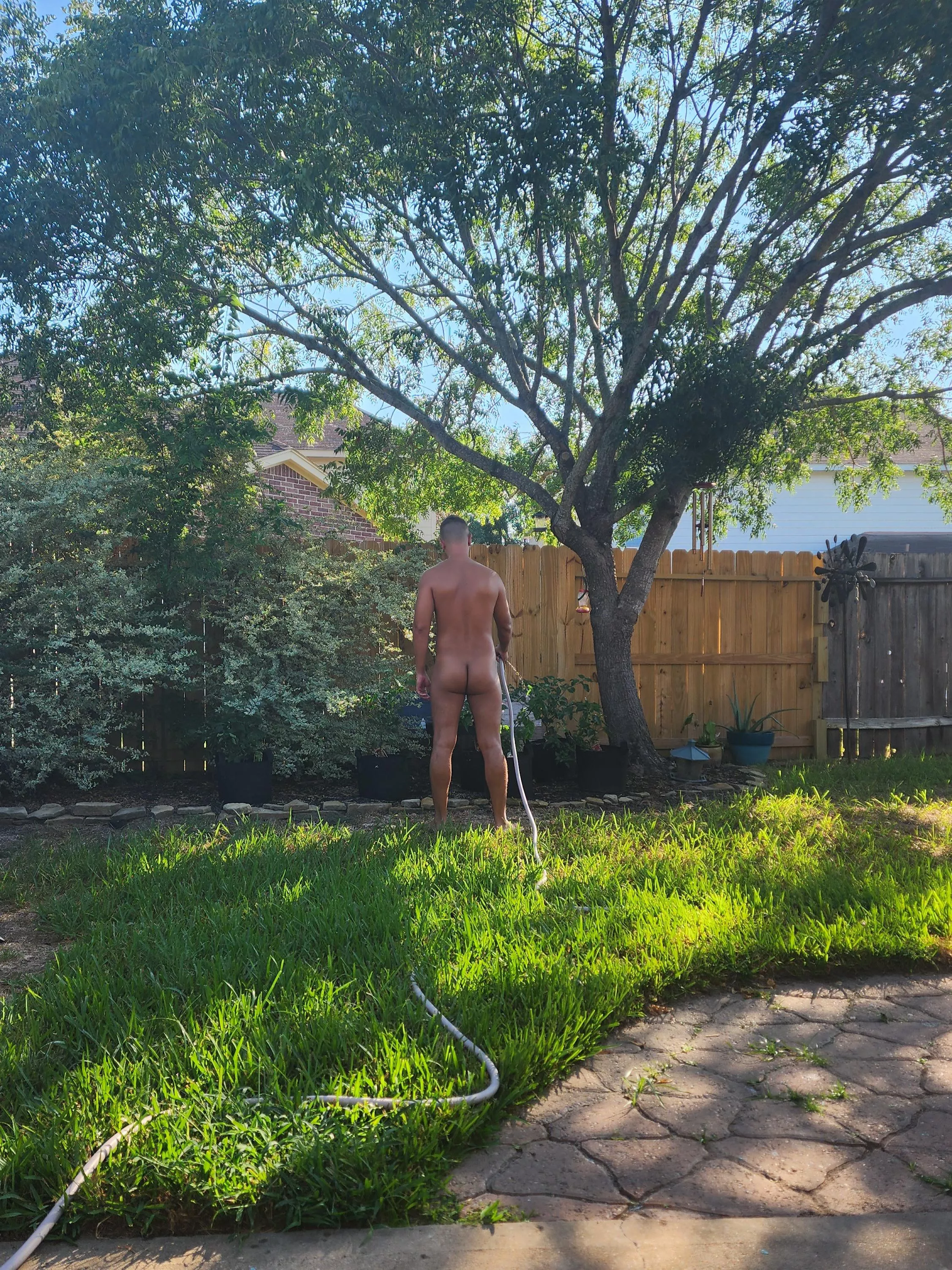 Watering my pepper plants.