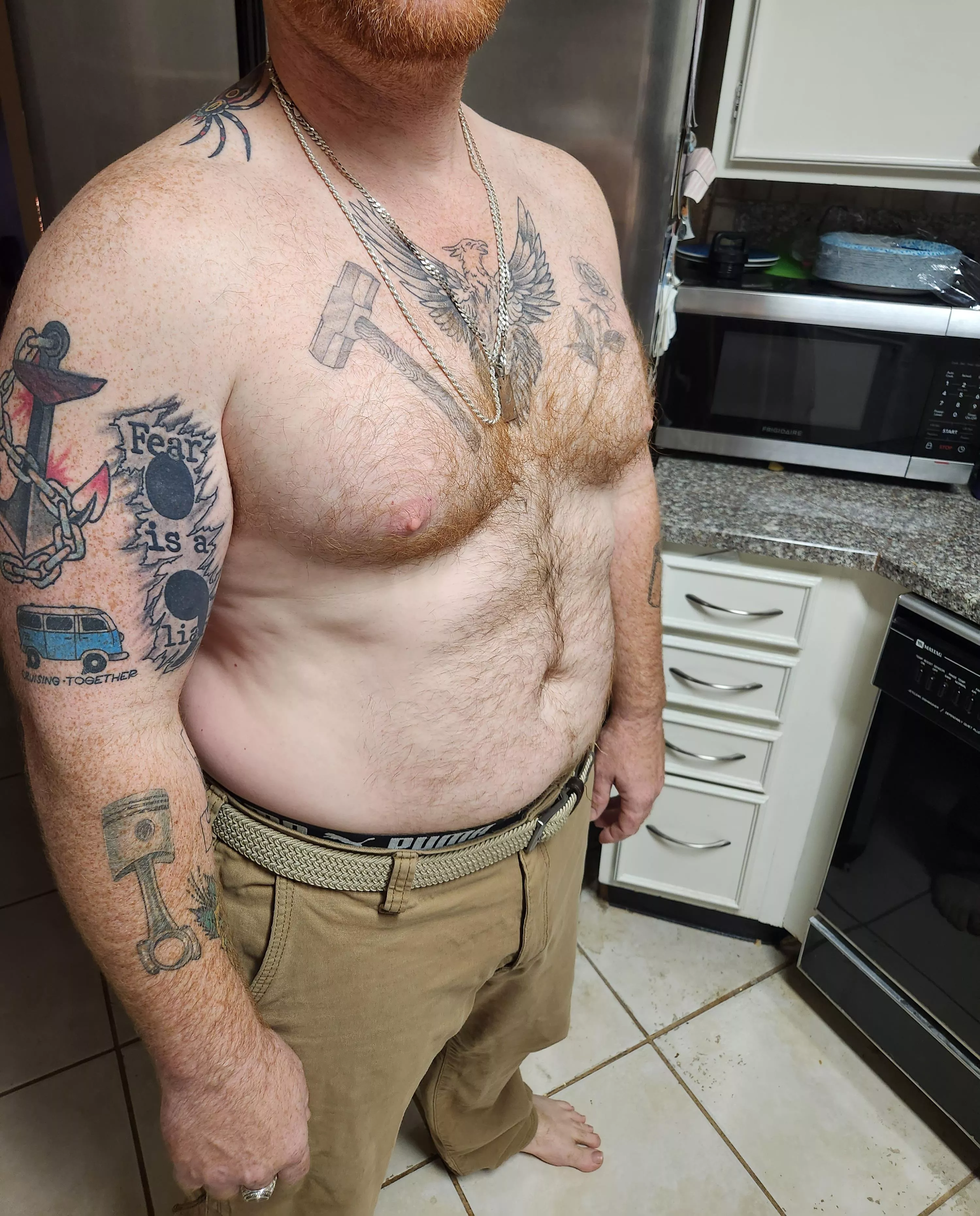 Ginger dadbod showing off some ink.