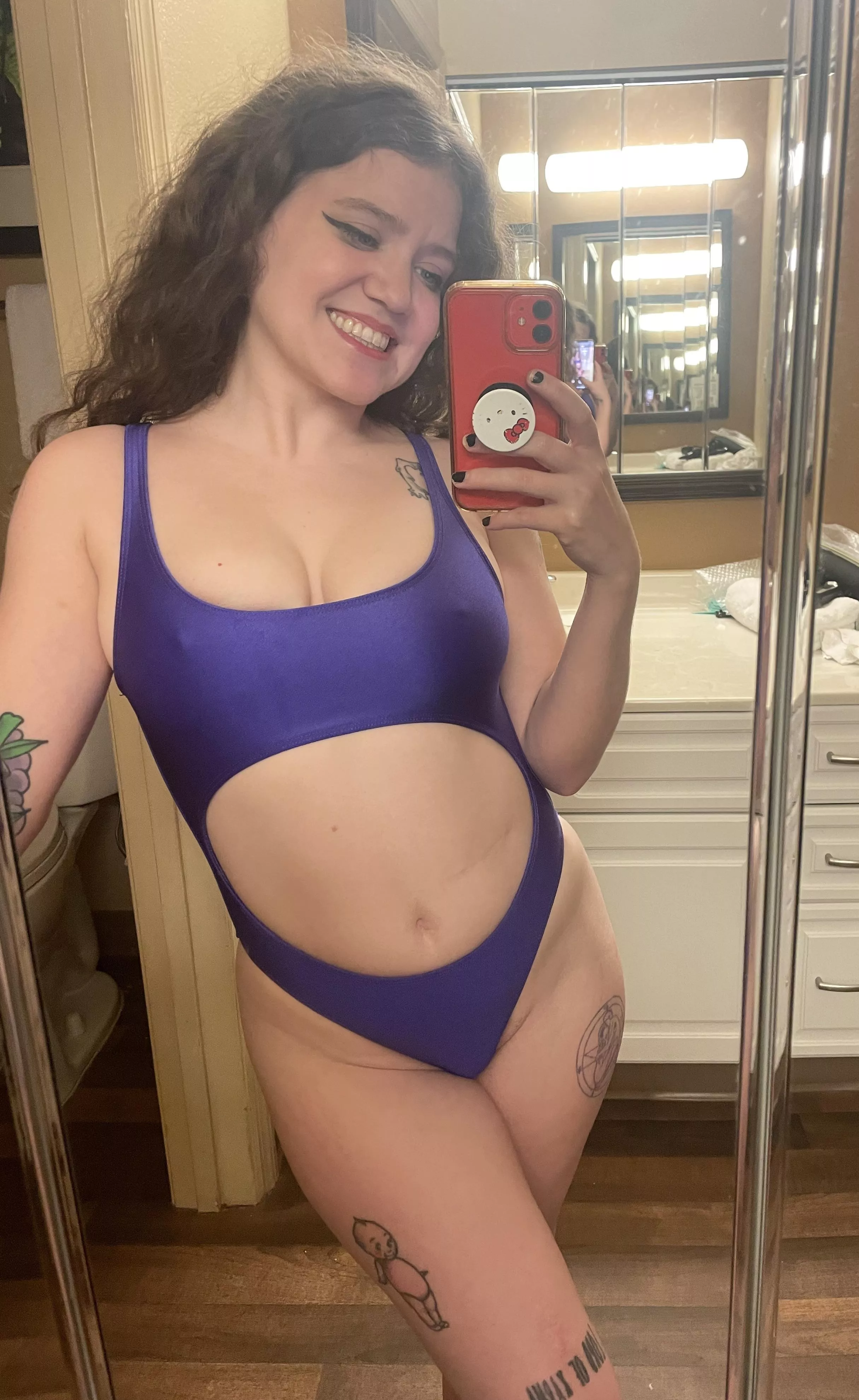 pokies in a tight and shiny swimsuit :)