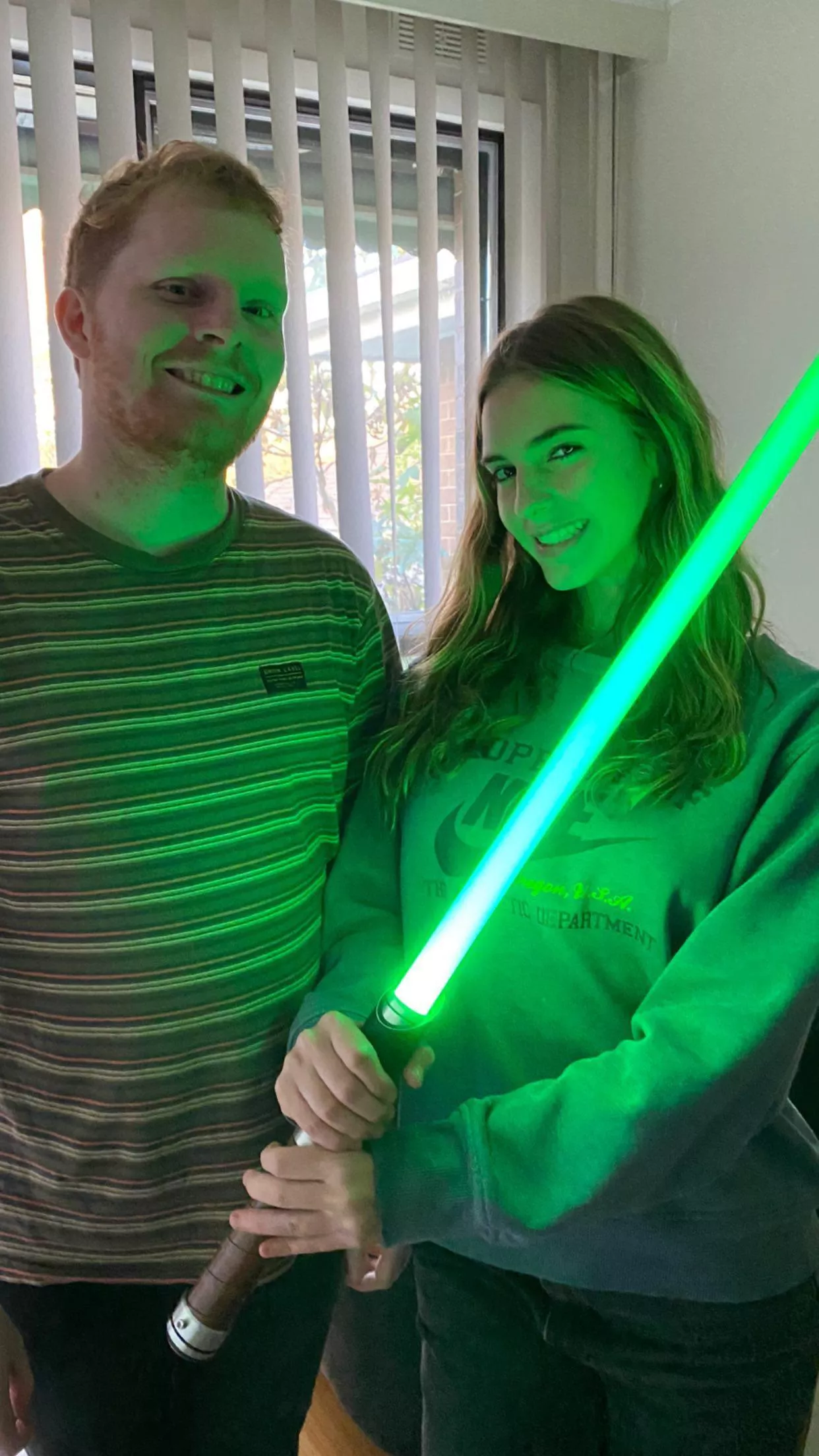 emily holding a light sabre really well