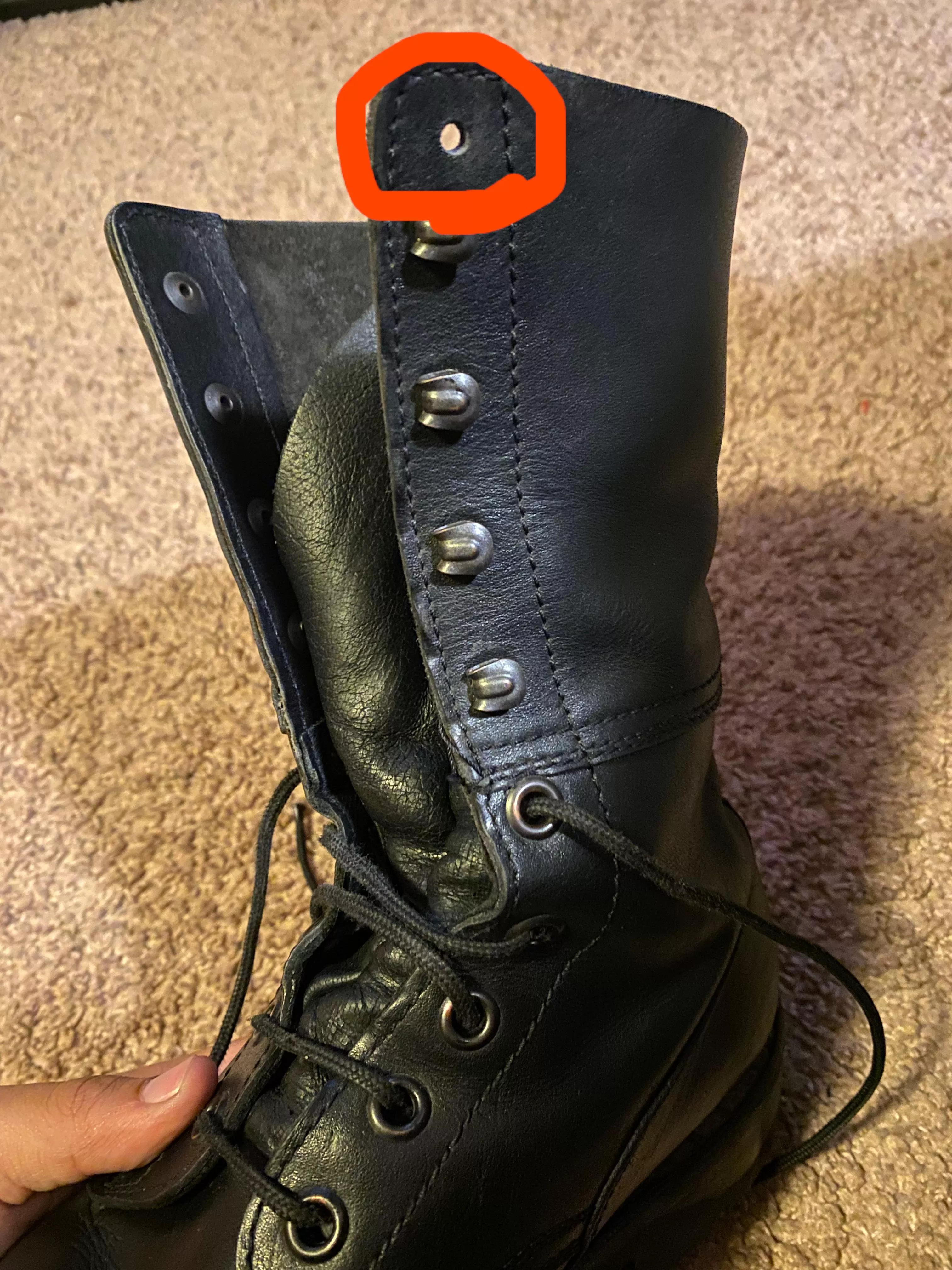 These surplus boots I bought have an extra eyelet on the inside flap of both boots. Can’t find any explanation of what they’re for. Thoughts?