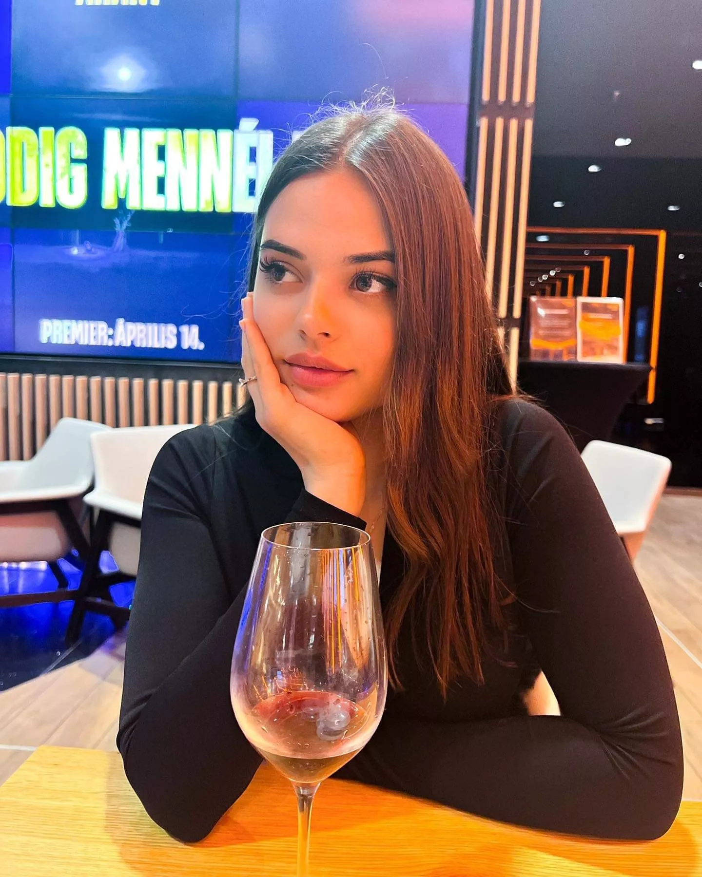 A pretty girl enjoying a glass of wine