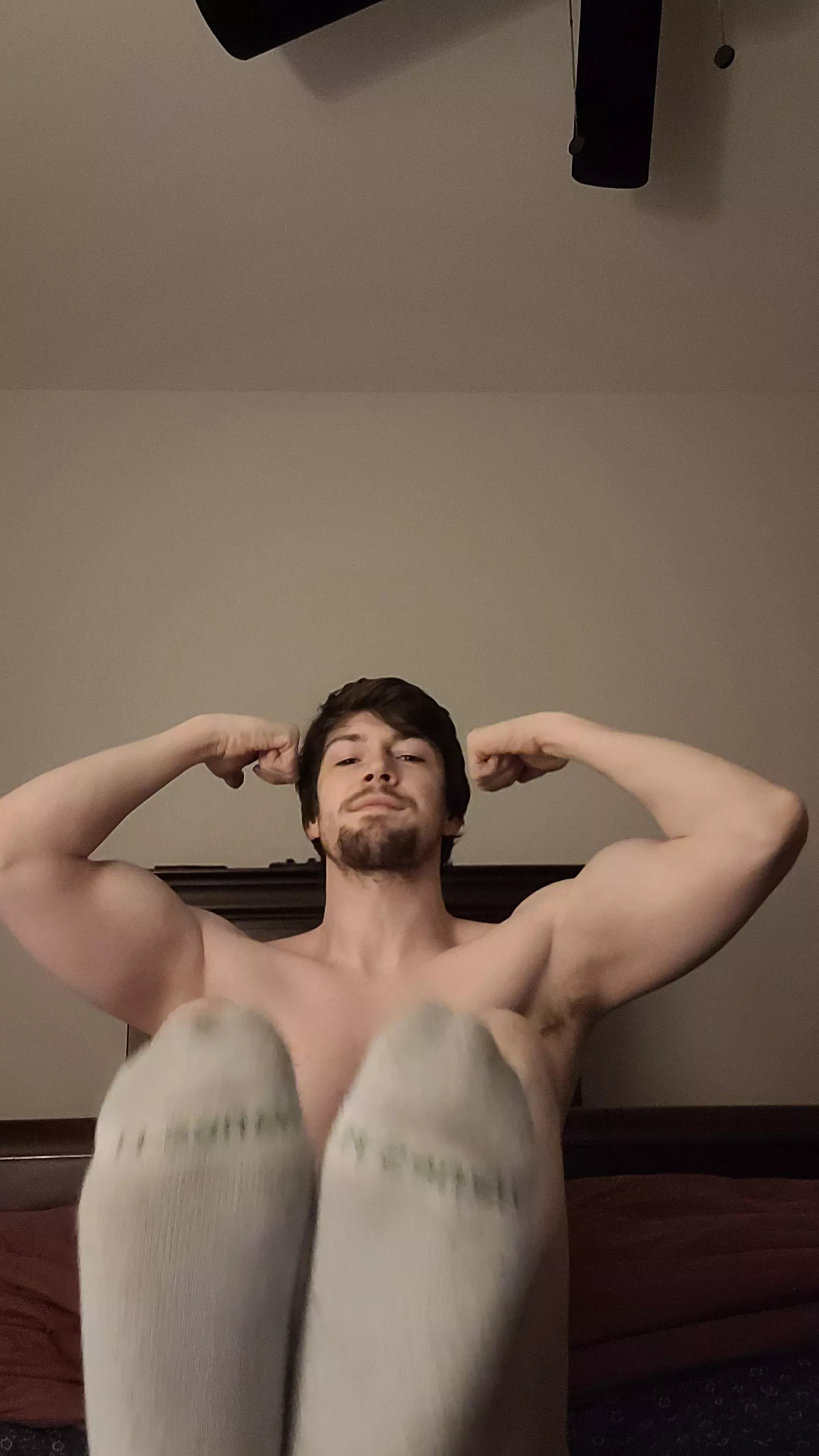 Flexed biceps with sweaty armpits and a side of dirty socks