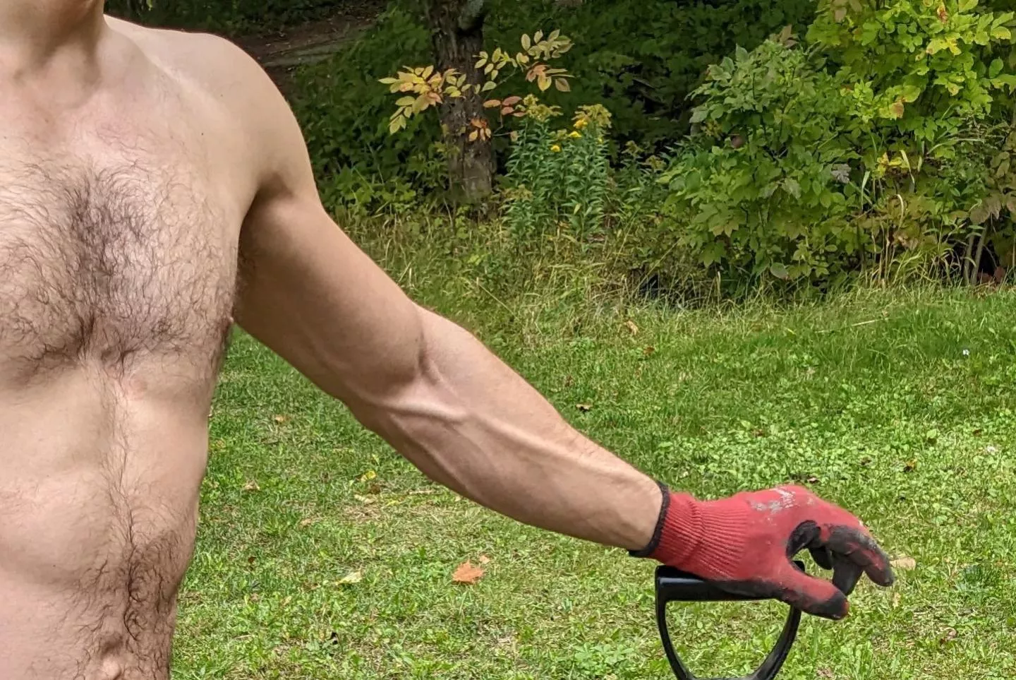 Shirtless and working in the yard