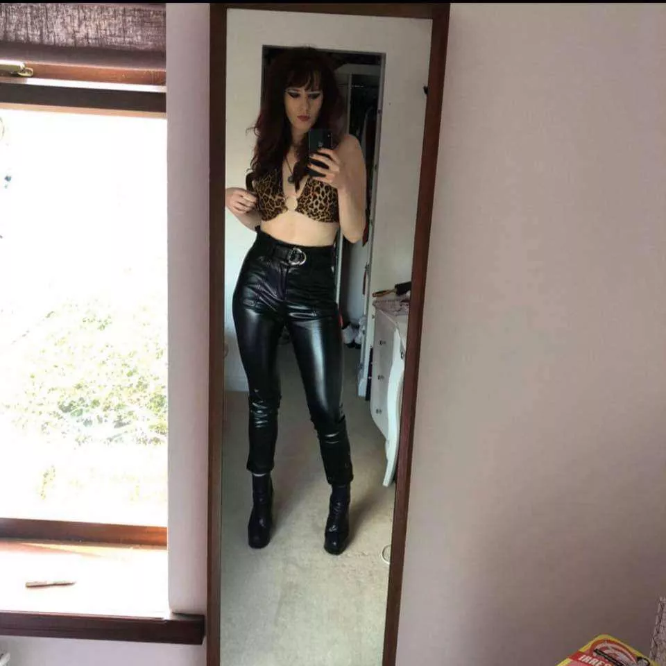 Sexy girl in leather black pants