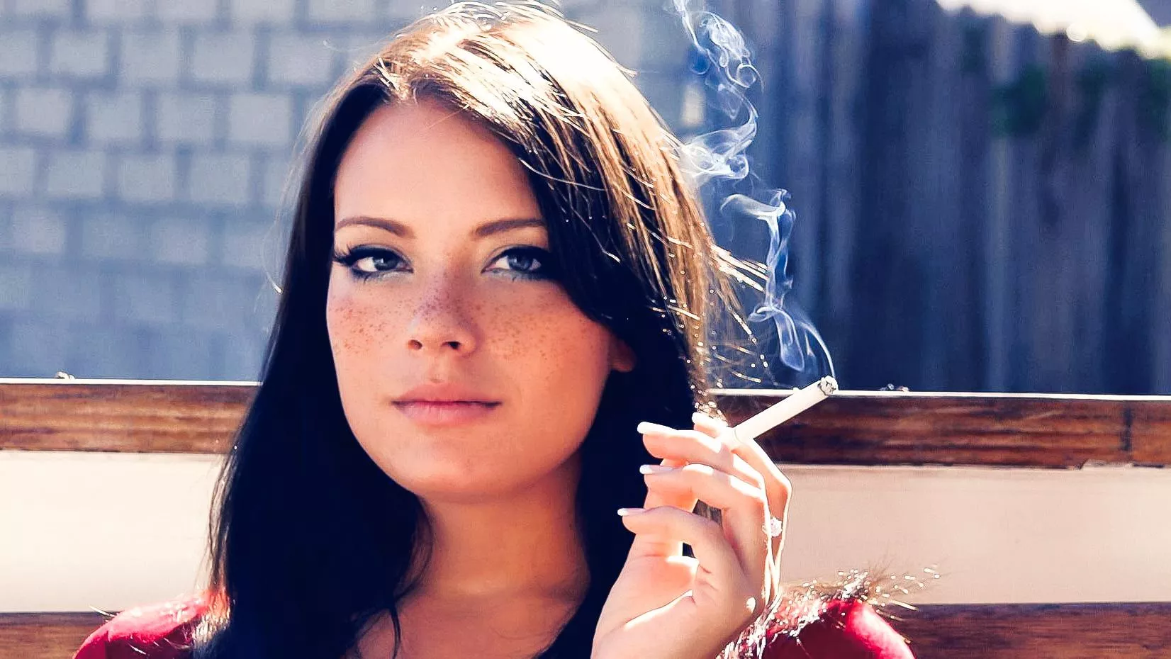 Brunette at a bus stop