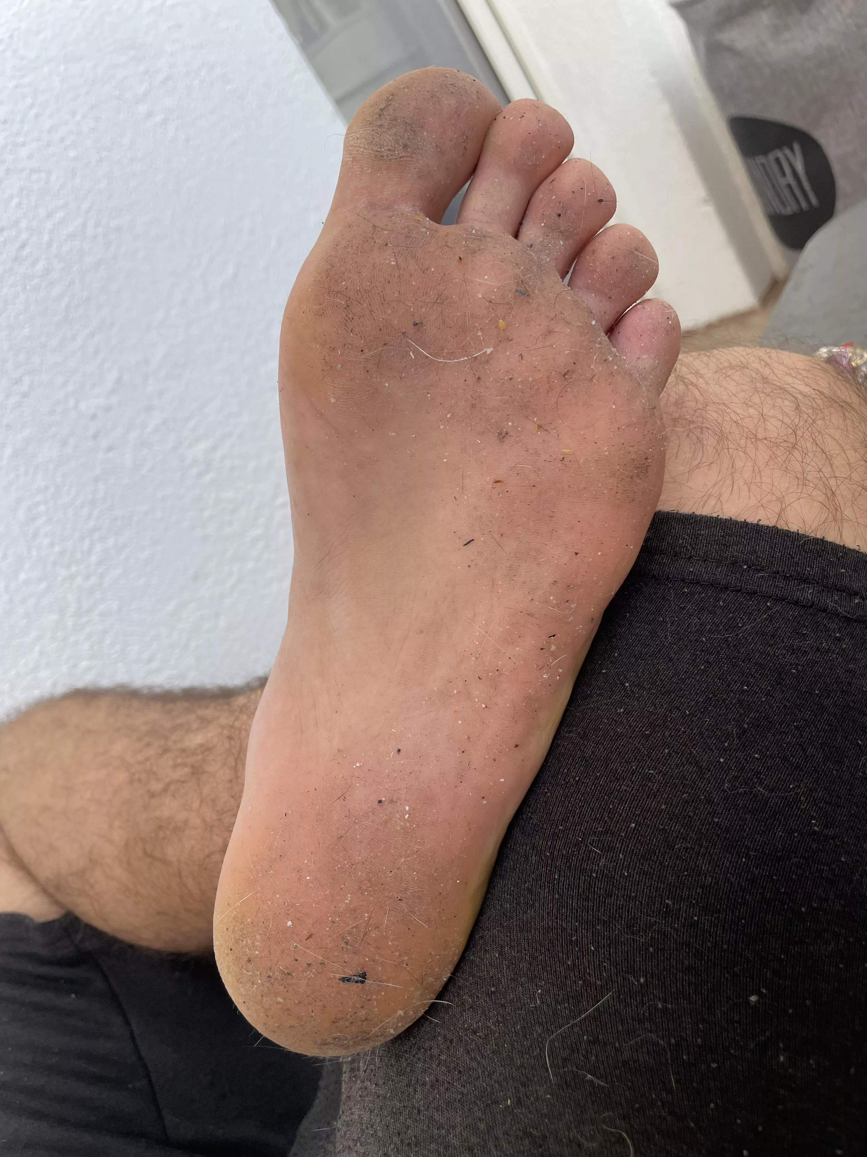 Get down and clean my big ass growing feet