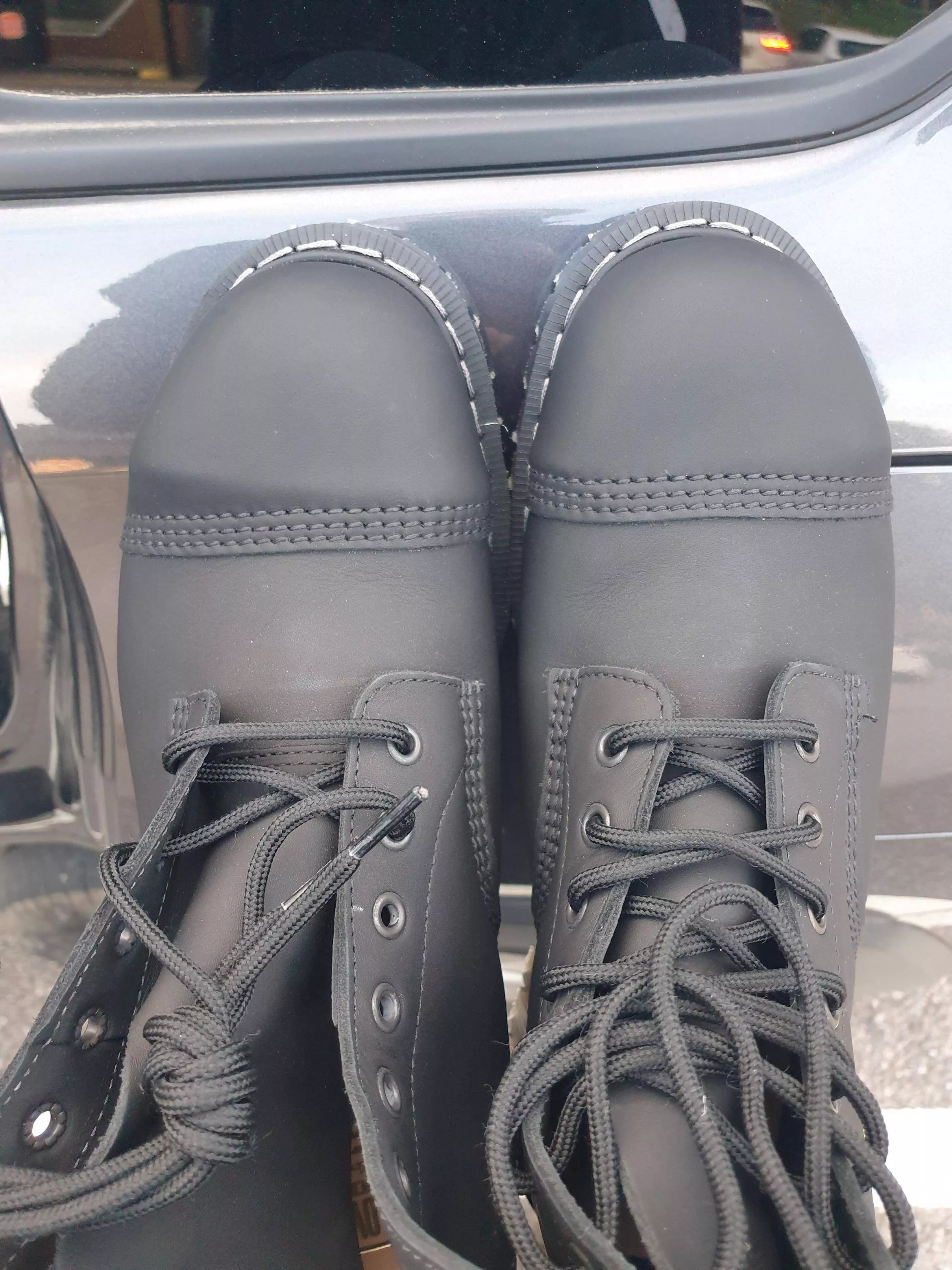 Bought a new pair of Solonair steel toe boots on sale (half price) but only later noticed how crooked 1 of the caps are, should I return? I'm guessing it won't fix itself?