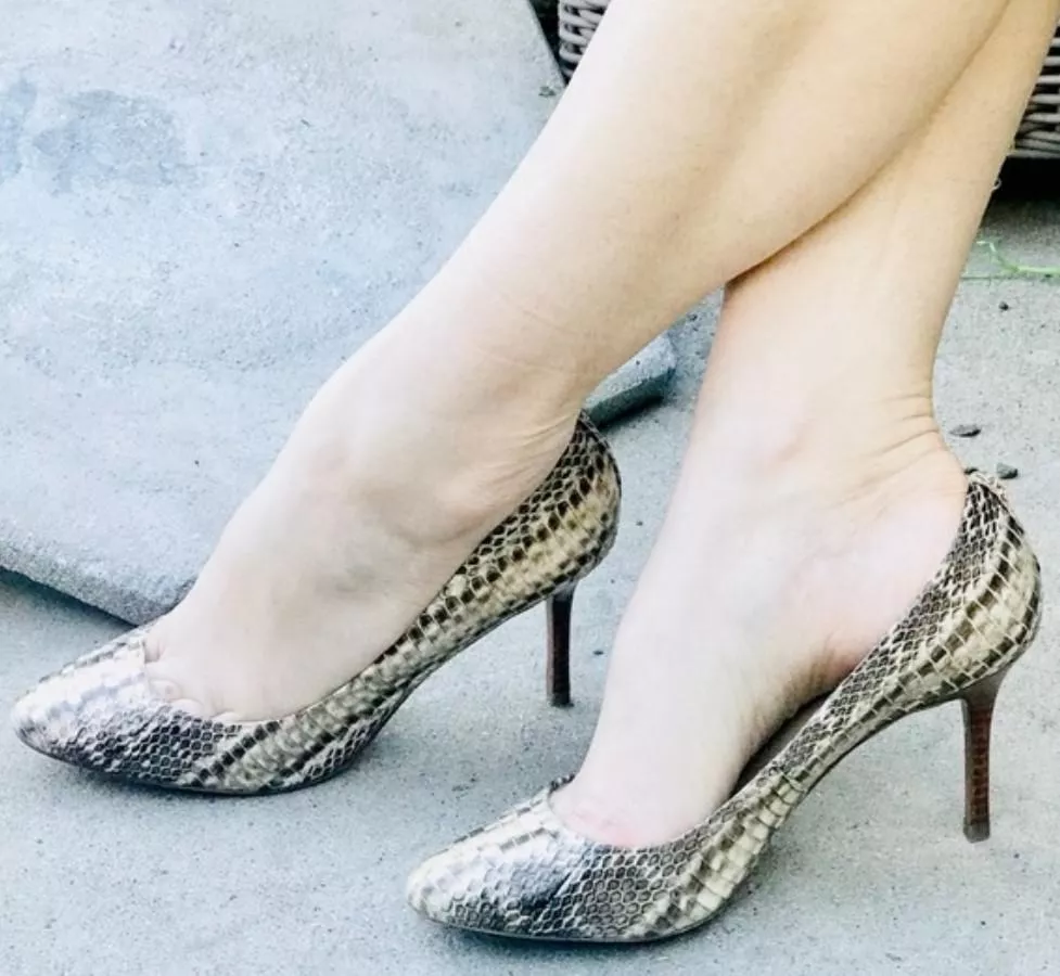 Snake skin high heel pumps