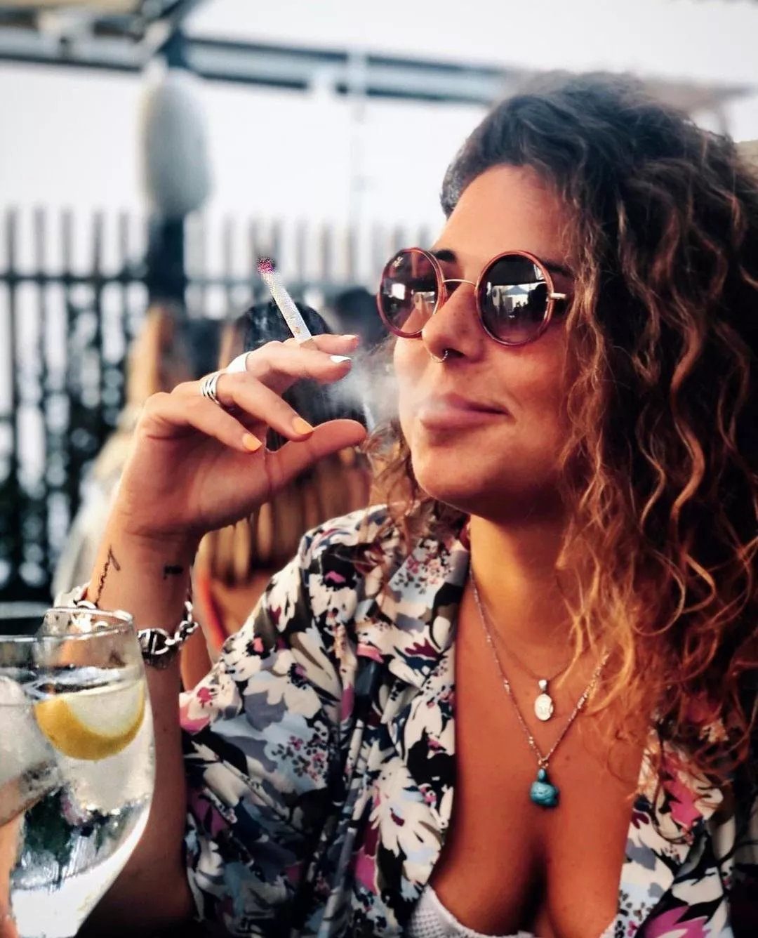 Gorgeous woman smoking at lunch