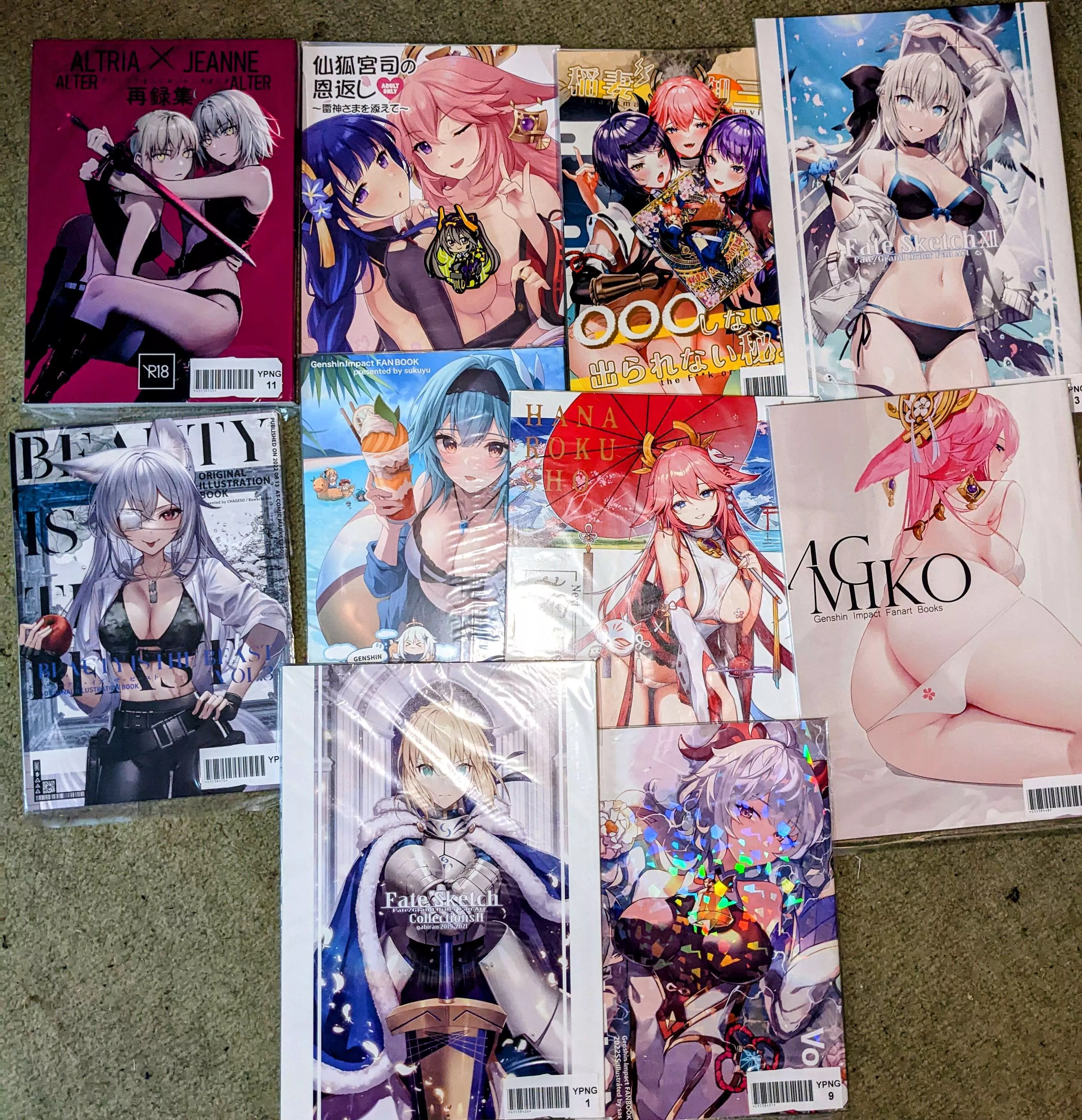 Small comiket collection of genshin/fate stuff