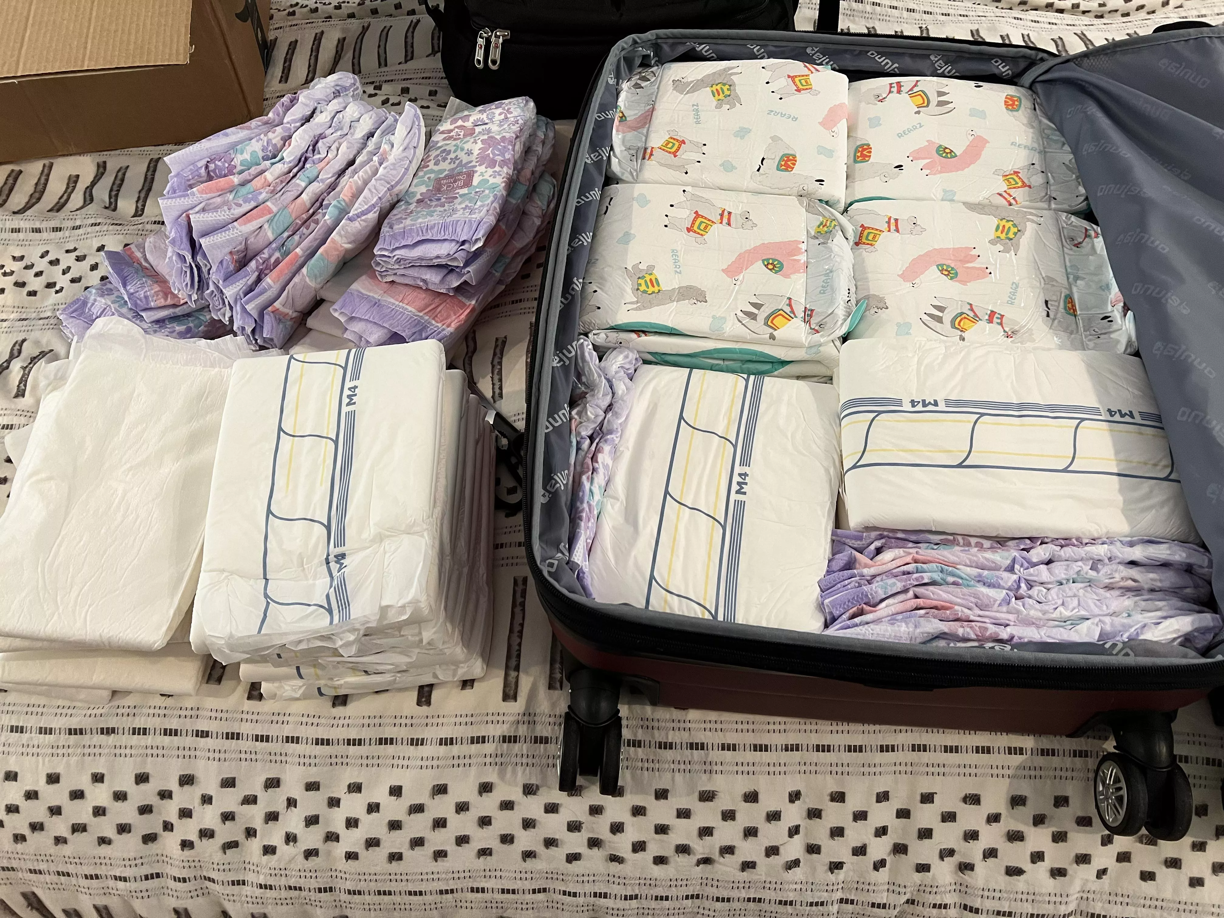 Ready for my trip. I made them fit loooool. More diapers then clothesâ€¦..is that a bad thing????