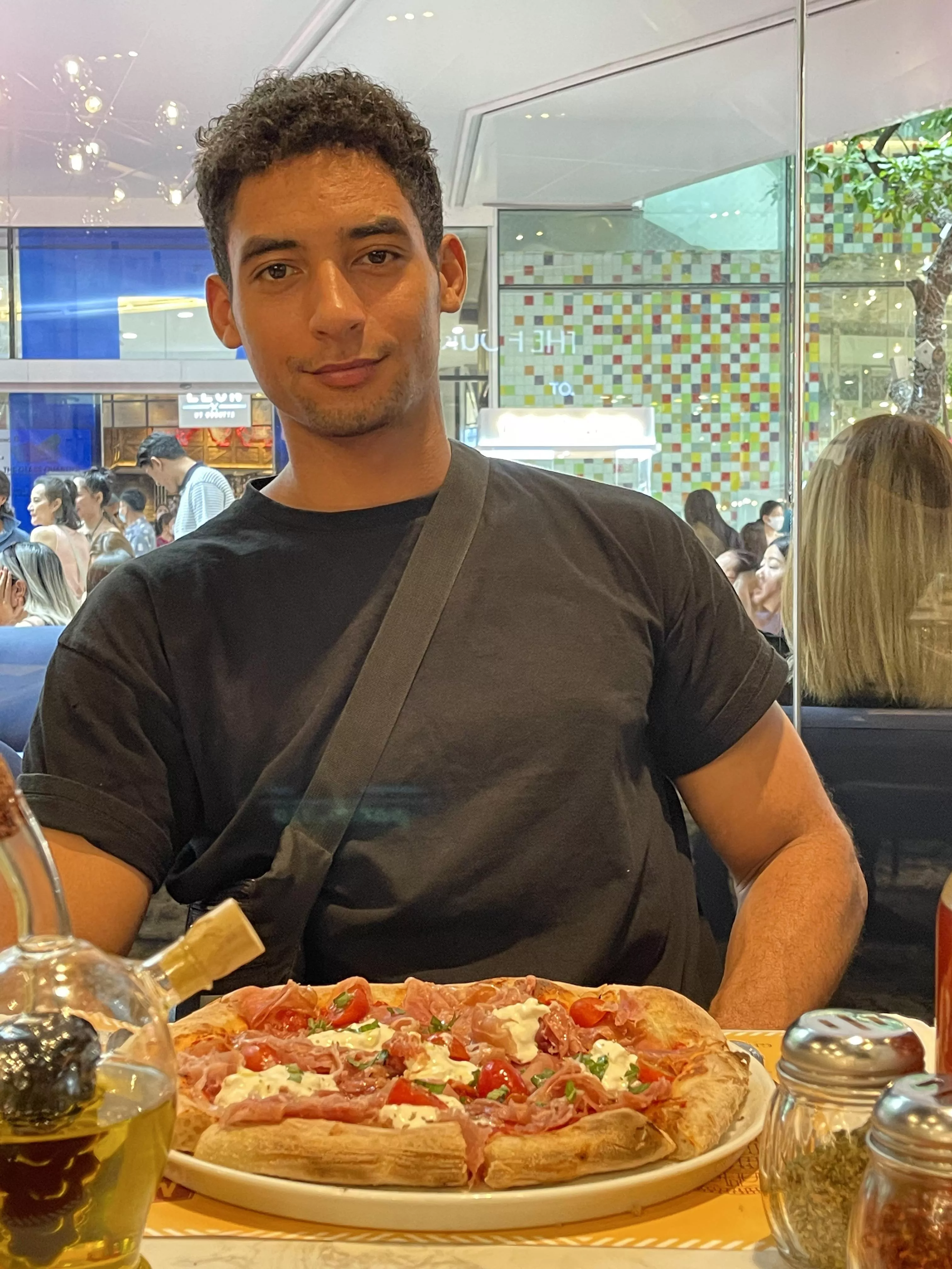 About to slay this delicious pizza here in downtown bangkok! Do you want a slice? ðŸ‘€