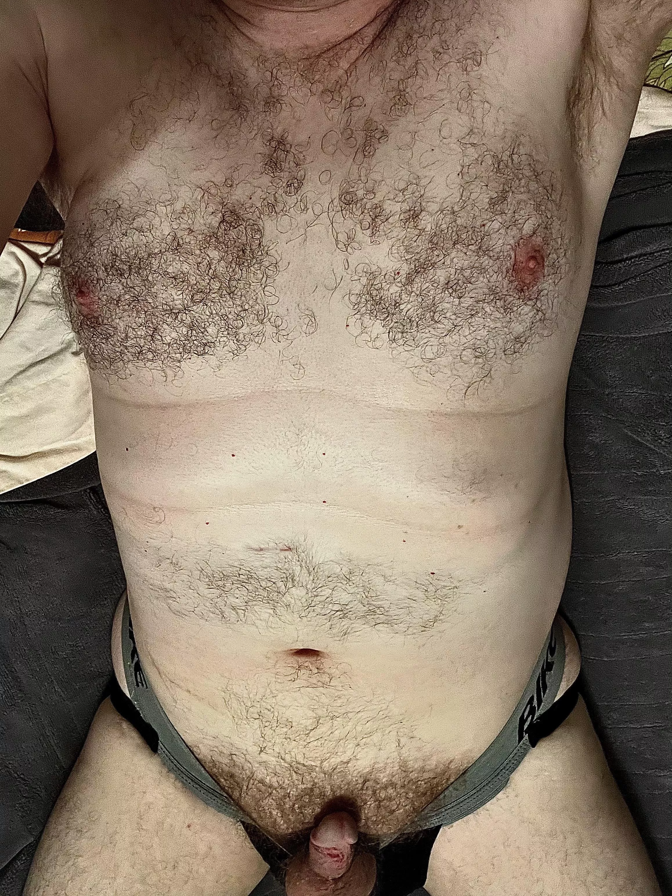 Jockstrap pulled down exposing my soft hairy cock