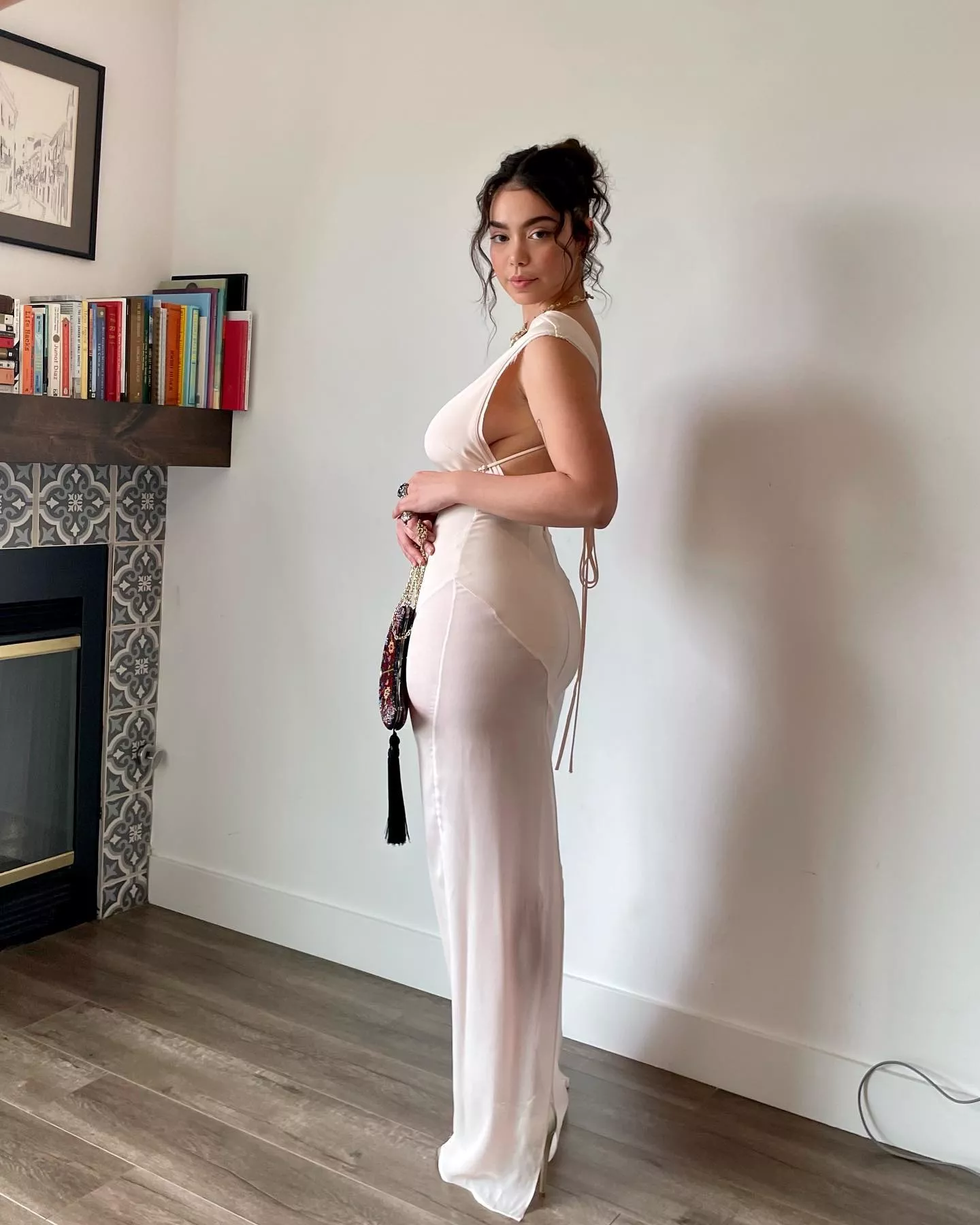 Auli'i Cravalho stretching that dress out