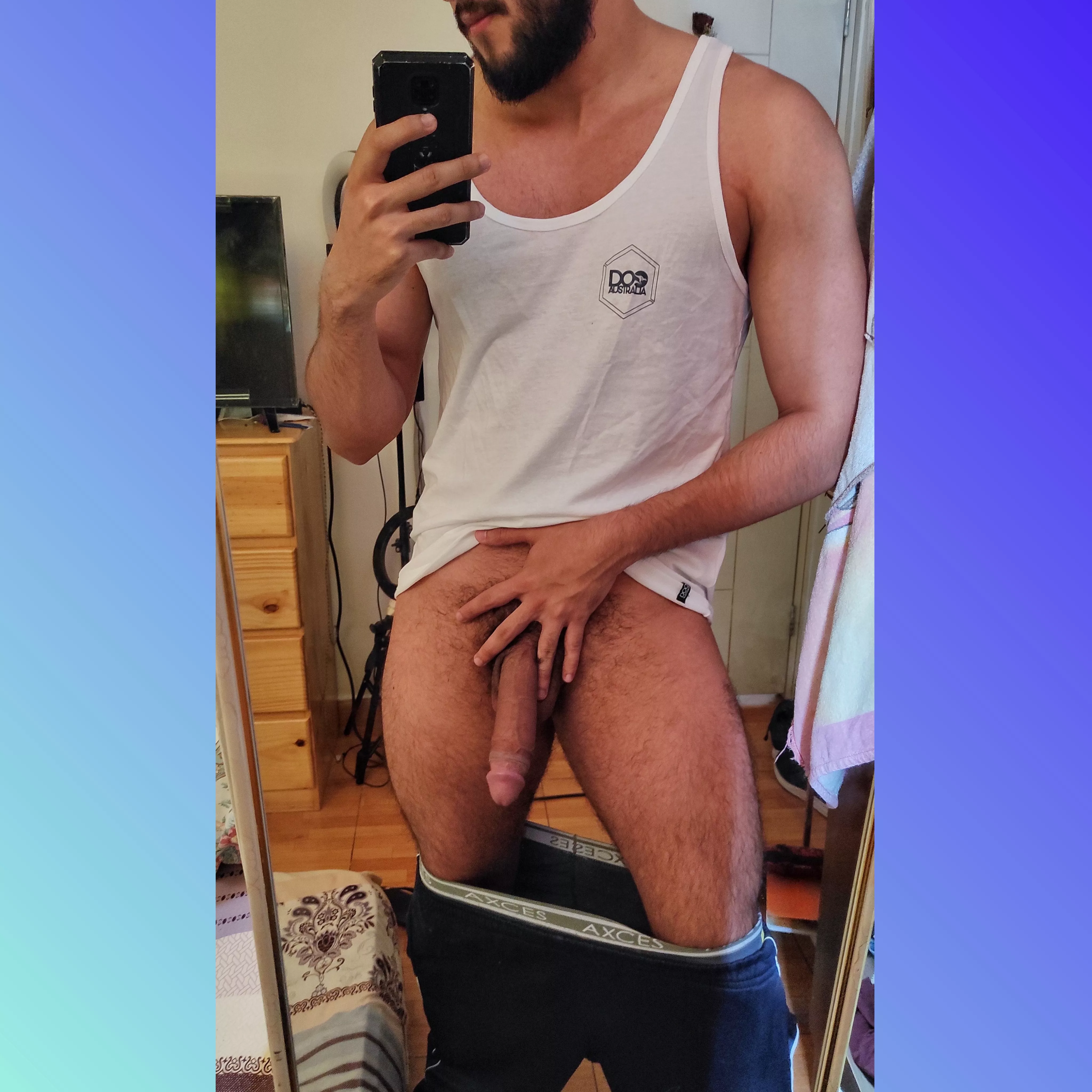 Bearded young man with a big cock