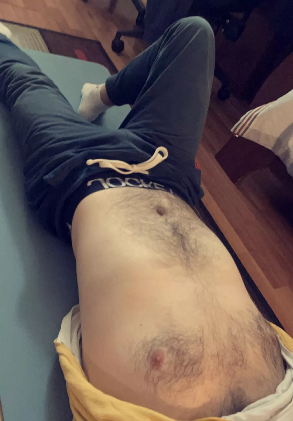 Bite my nipples while you caress my bulge.