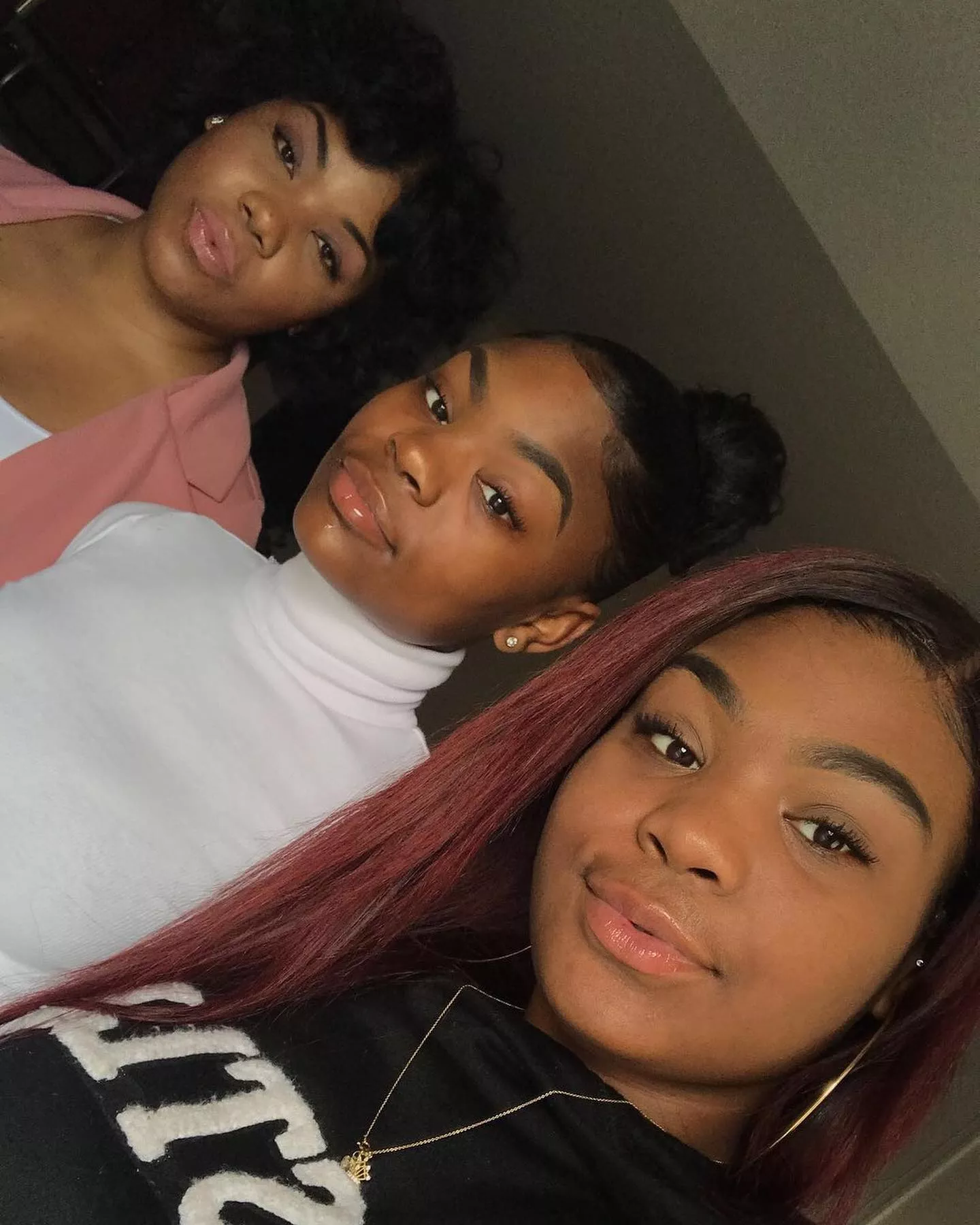 Black/Ebony Mom is in her late 40s, daughters are 19 and 23 respectively