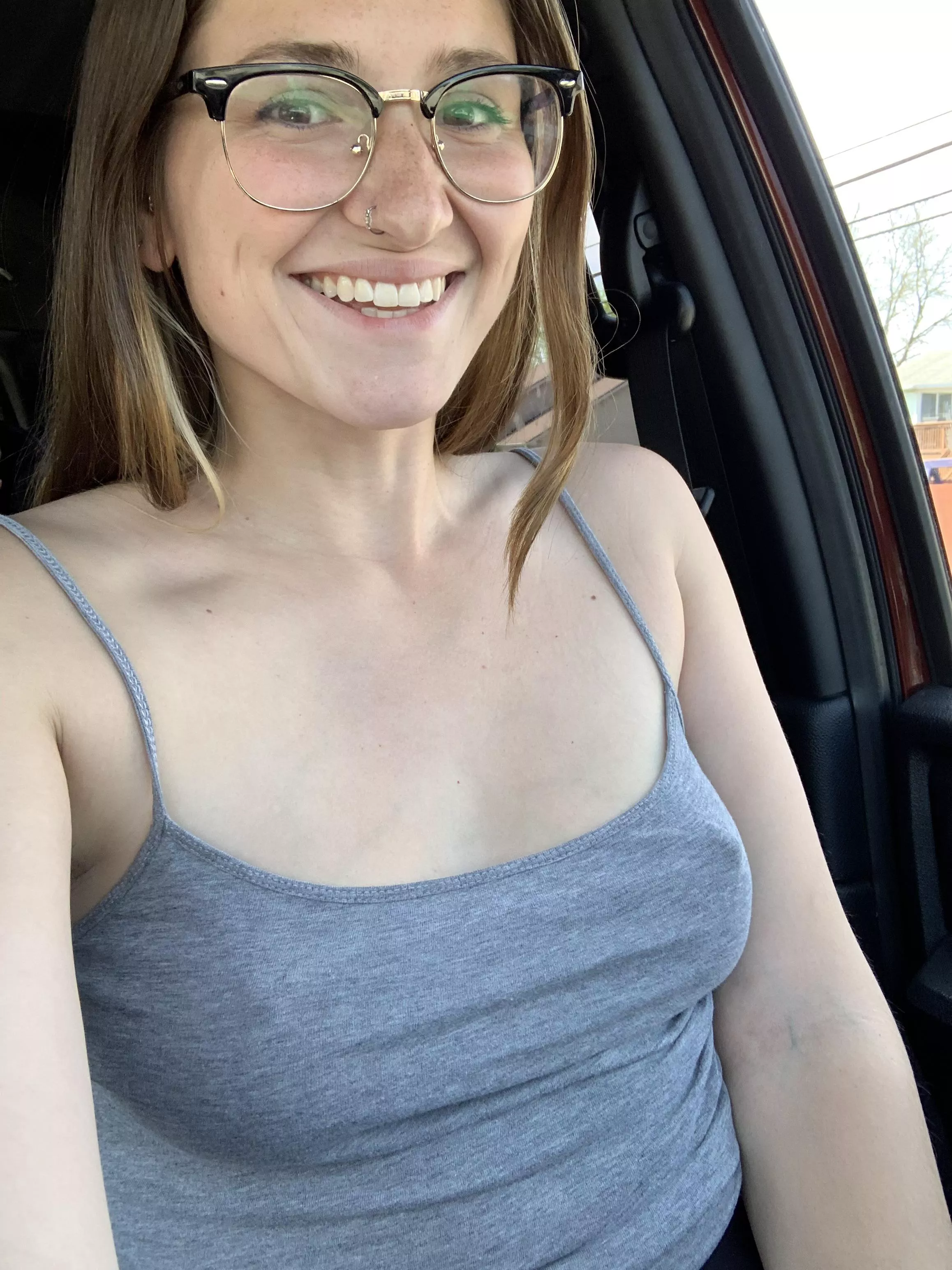 Braless in the car. Love the feeling of hard nipples under a soft shirt