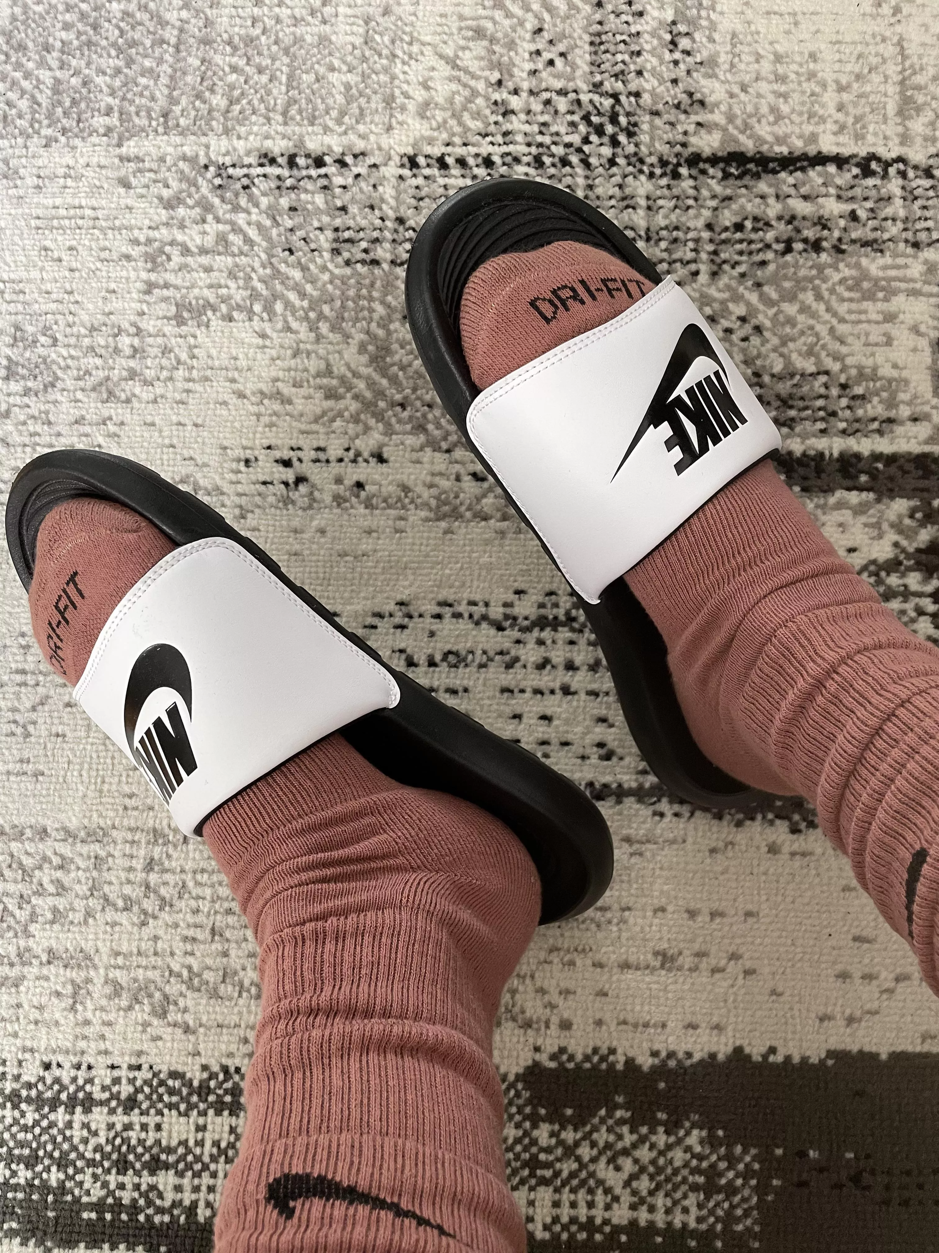 Brown Nike Dri-Fit and Victori One slides