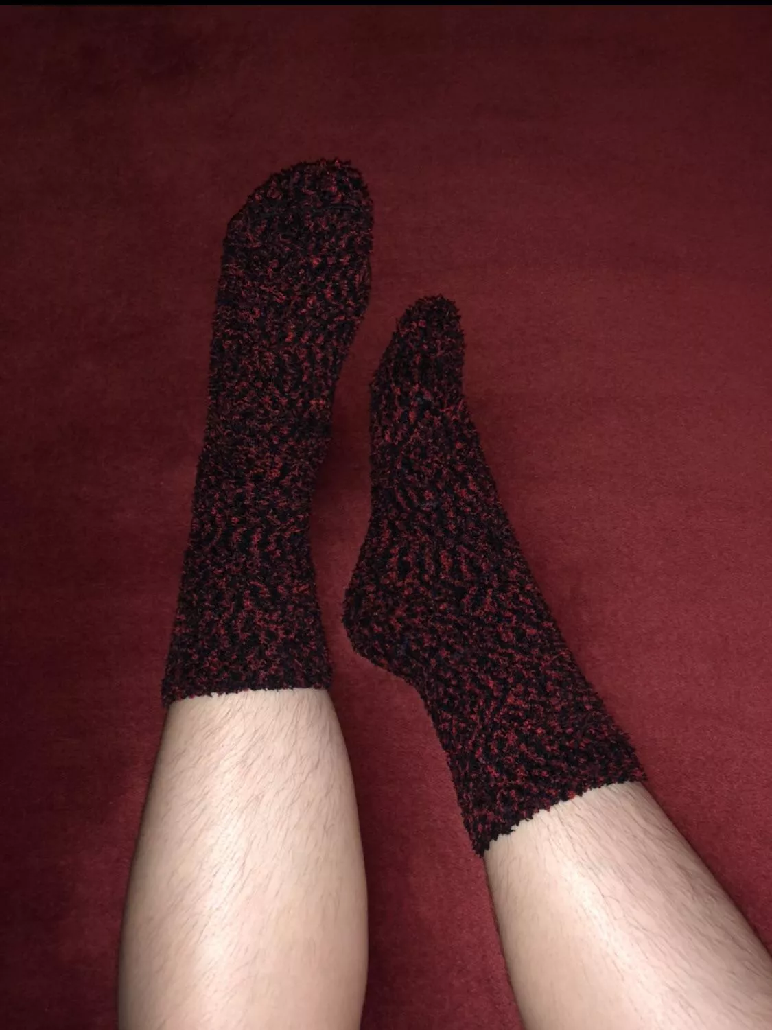 Can you help me take off these red and black fluffy socks?