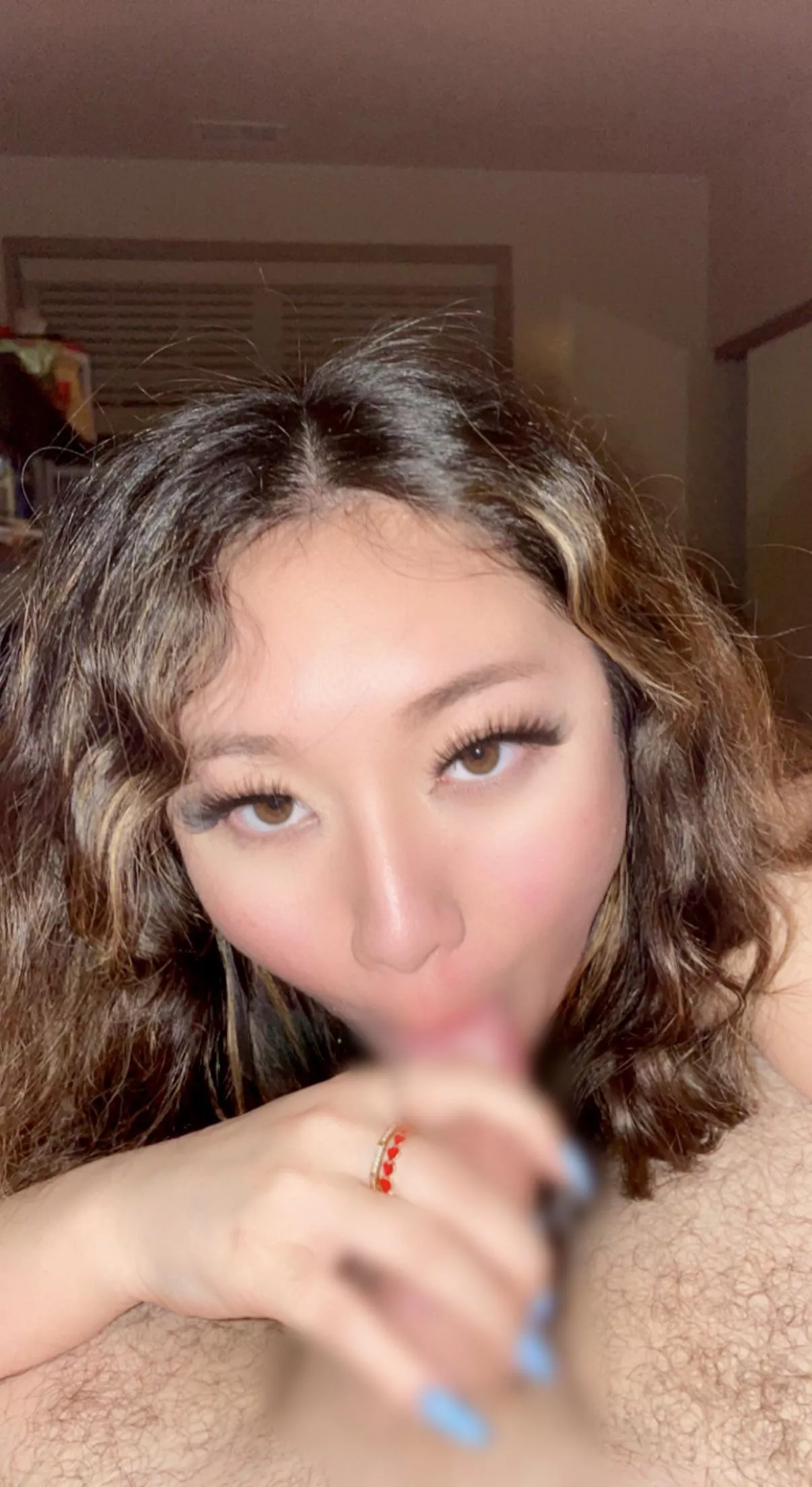 Chinese girl with amber eyes sucking the soul out of daddy’s white cock