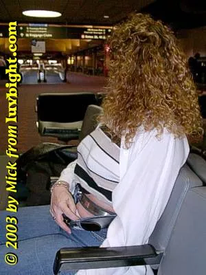 Dee wearing her Access Denied chastity belt through airport security in 2001.