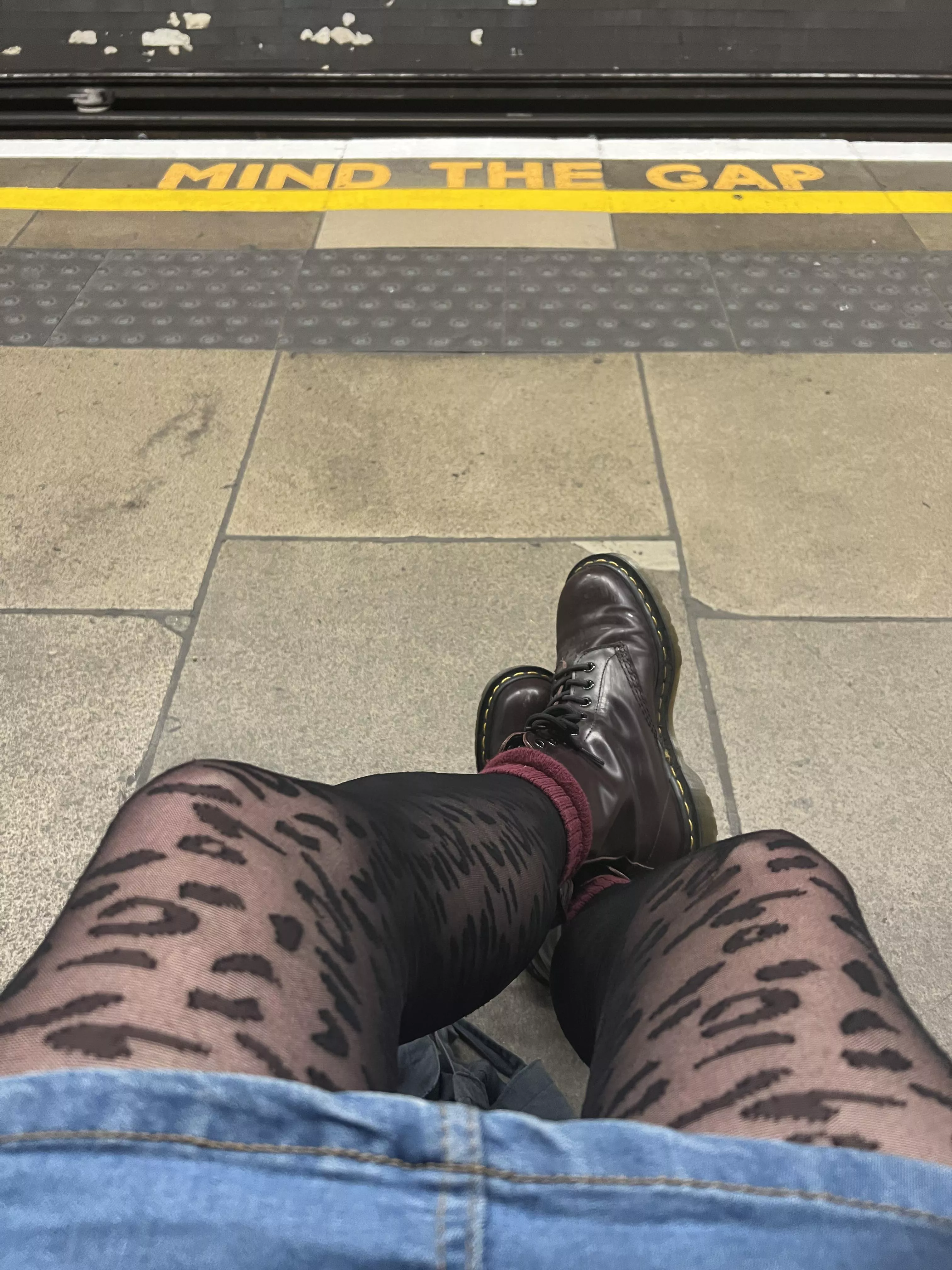 Docs and tights on the underground