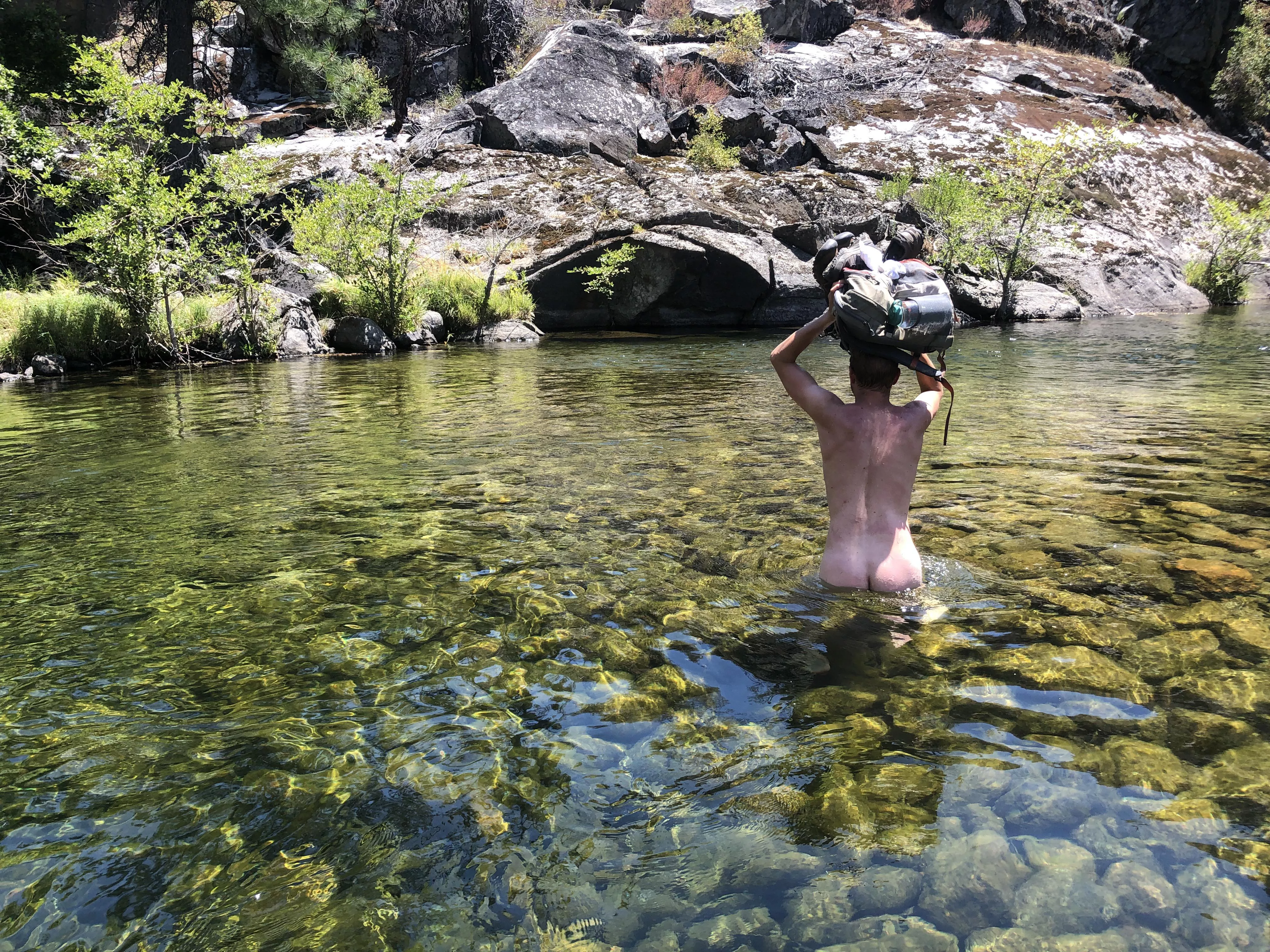 Fording the Tuolumne River for a good camping spot.