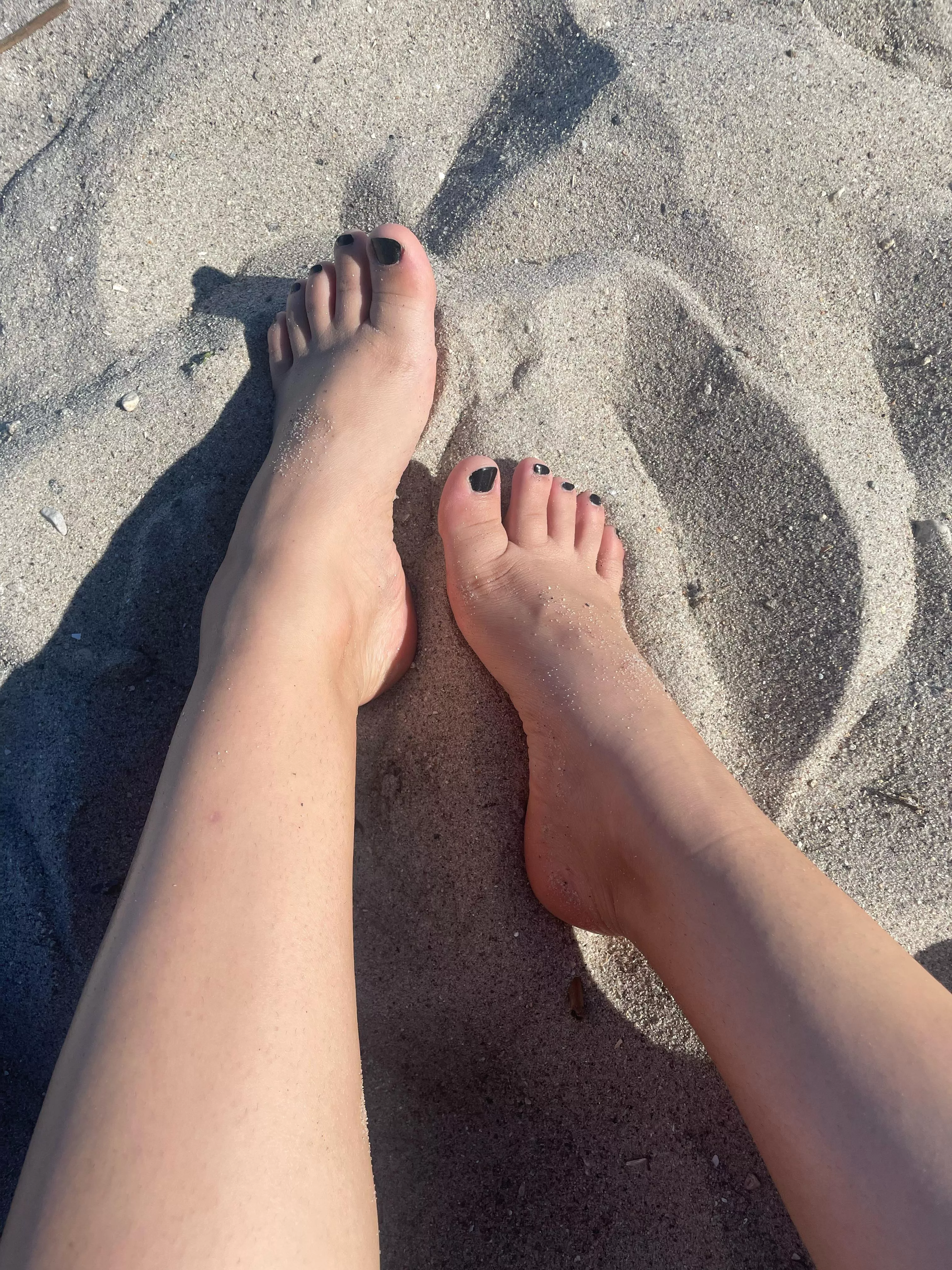 freshly pedicured toes slipping into the sand