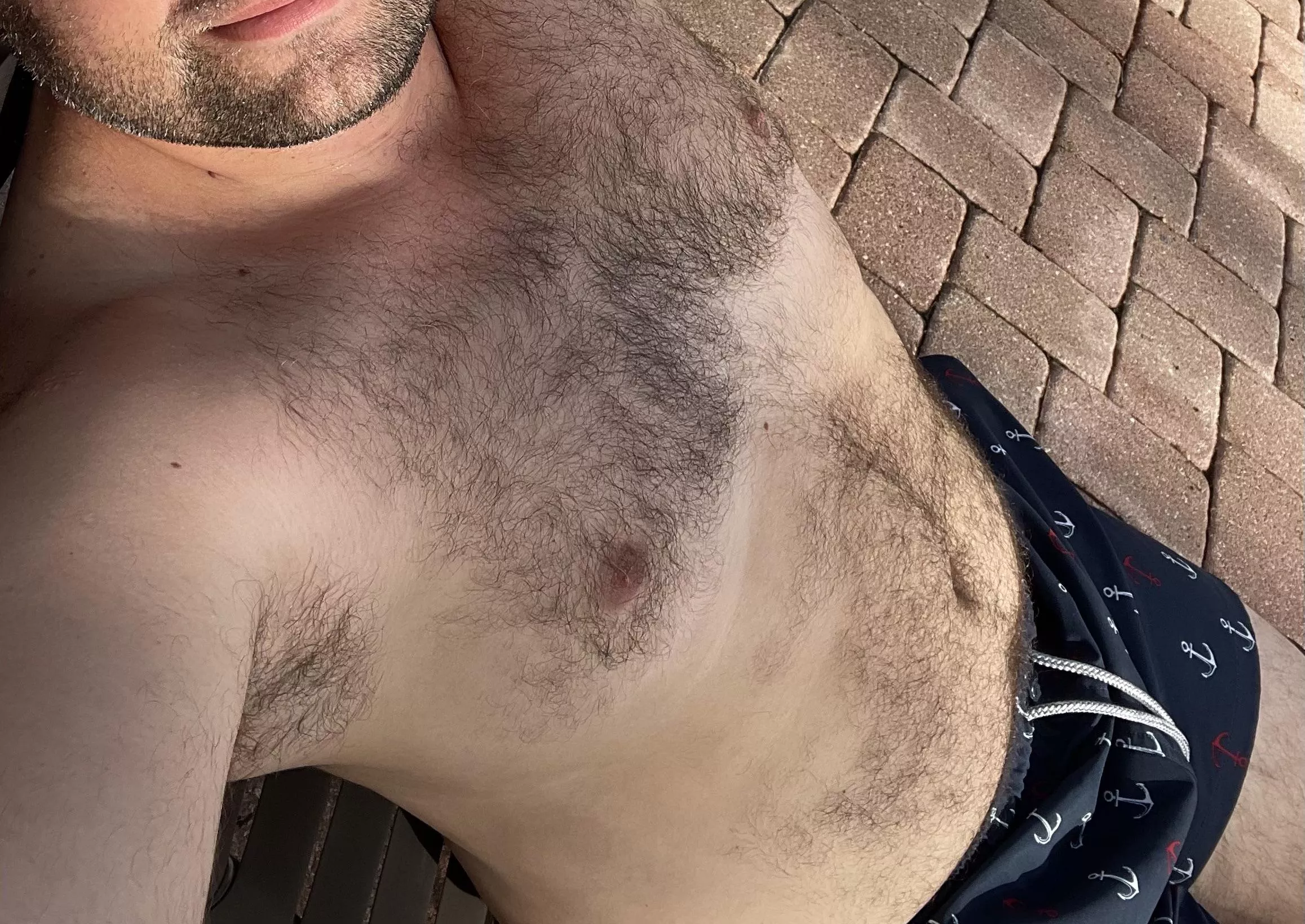 Getting the (35) yr dad bod some sun at the pool. Skinny dip with me?