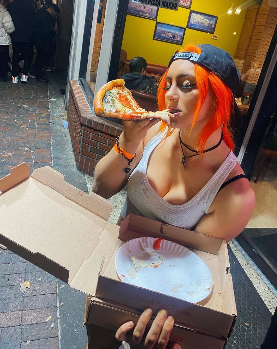 Gigi Dolin with pizza.