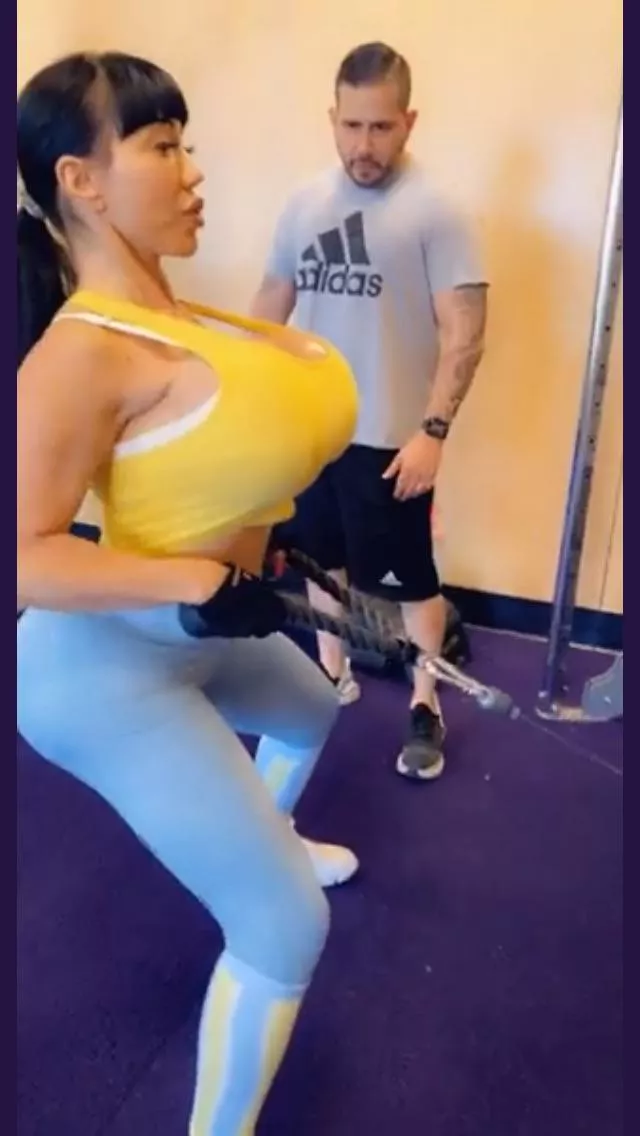 He trainer can’t keep his eyes off her giant ass and fake bimbo knockers!