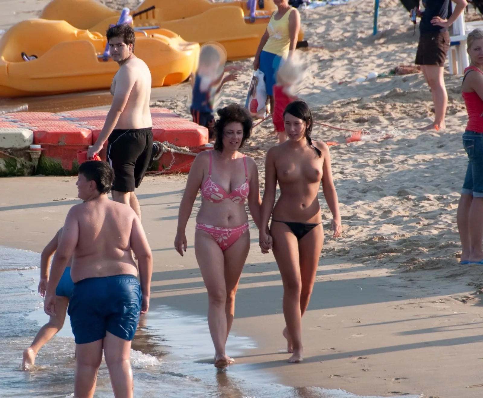 Holding hands on the beach