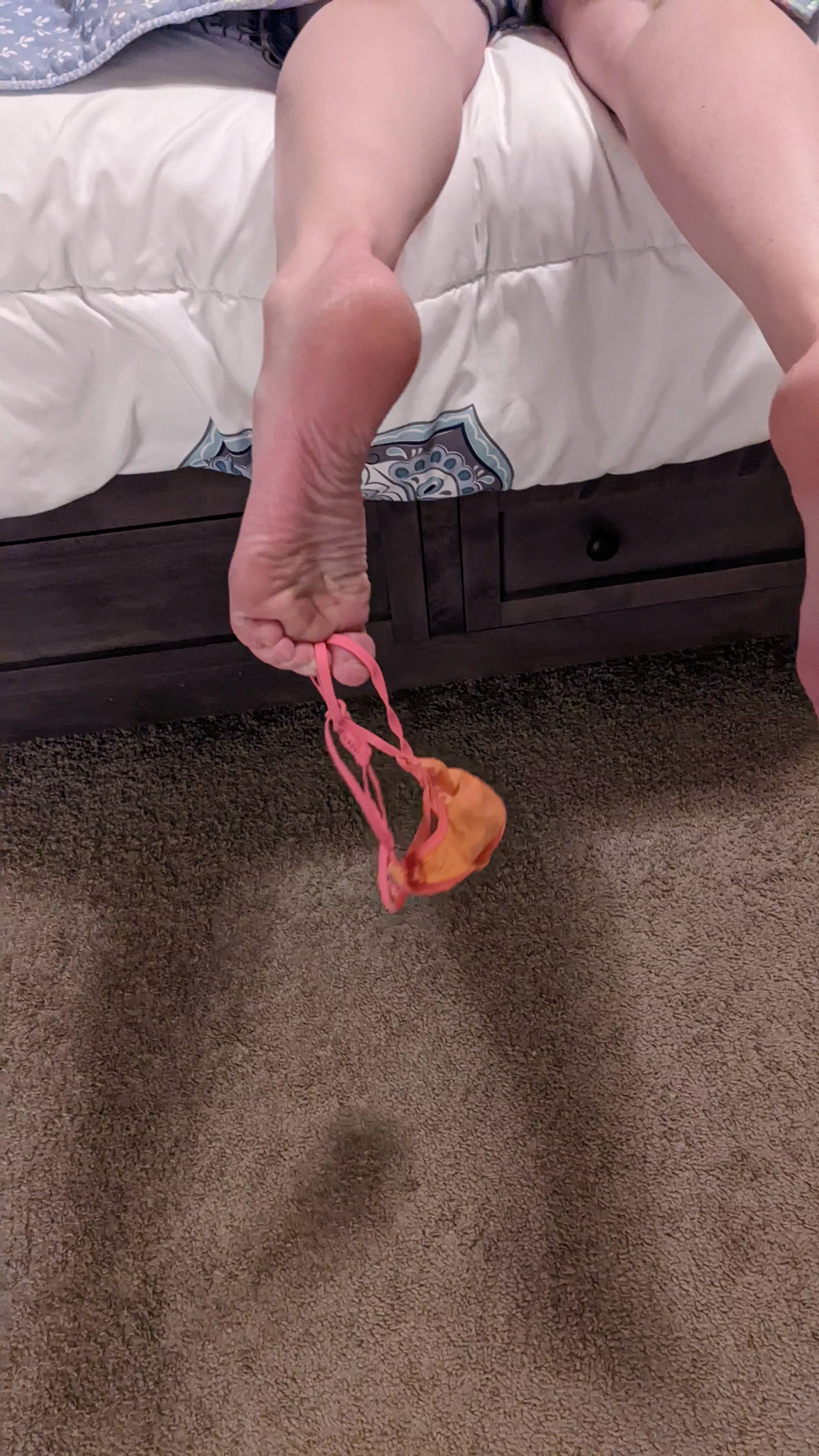 Holding the thong with my toes