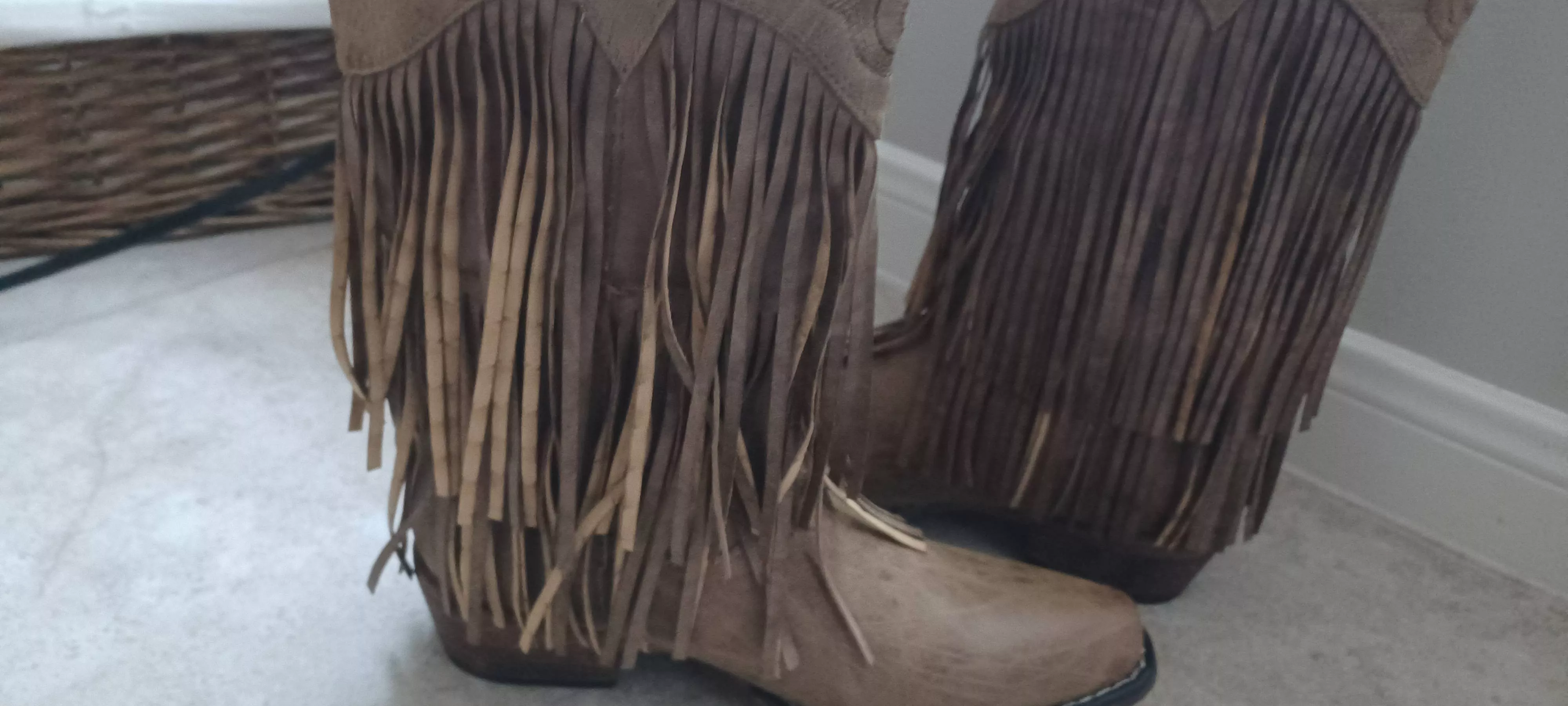 How do I straighten the fringe (left) so it looks like the right boot? Or should I return them and get my money back?