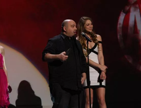 Jessie at awards event with a fat man...