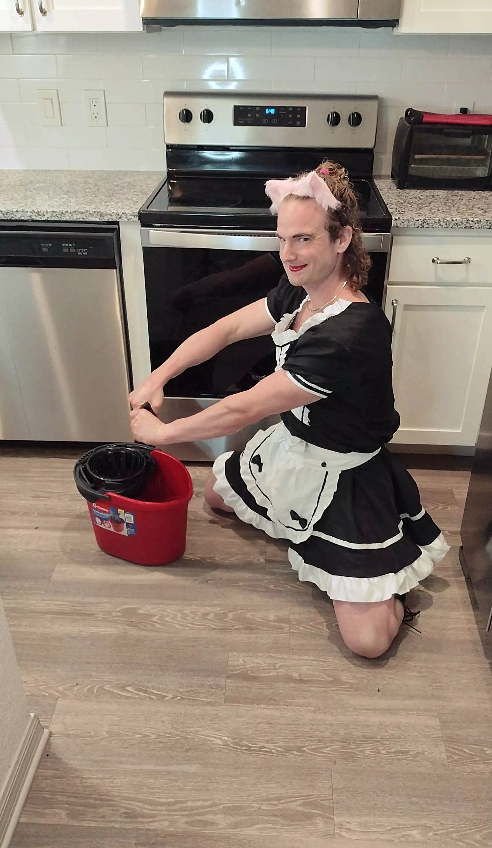 Just being a good little maid and getting the house clean for the week