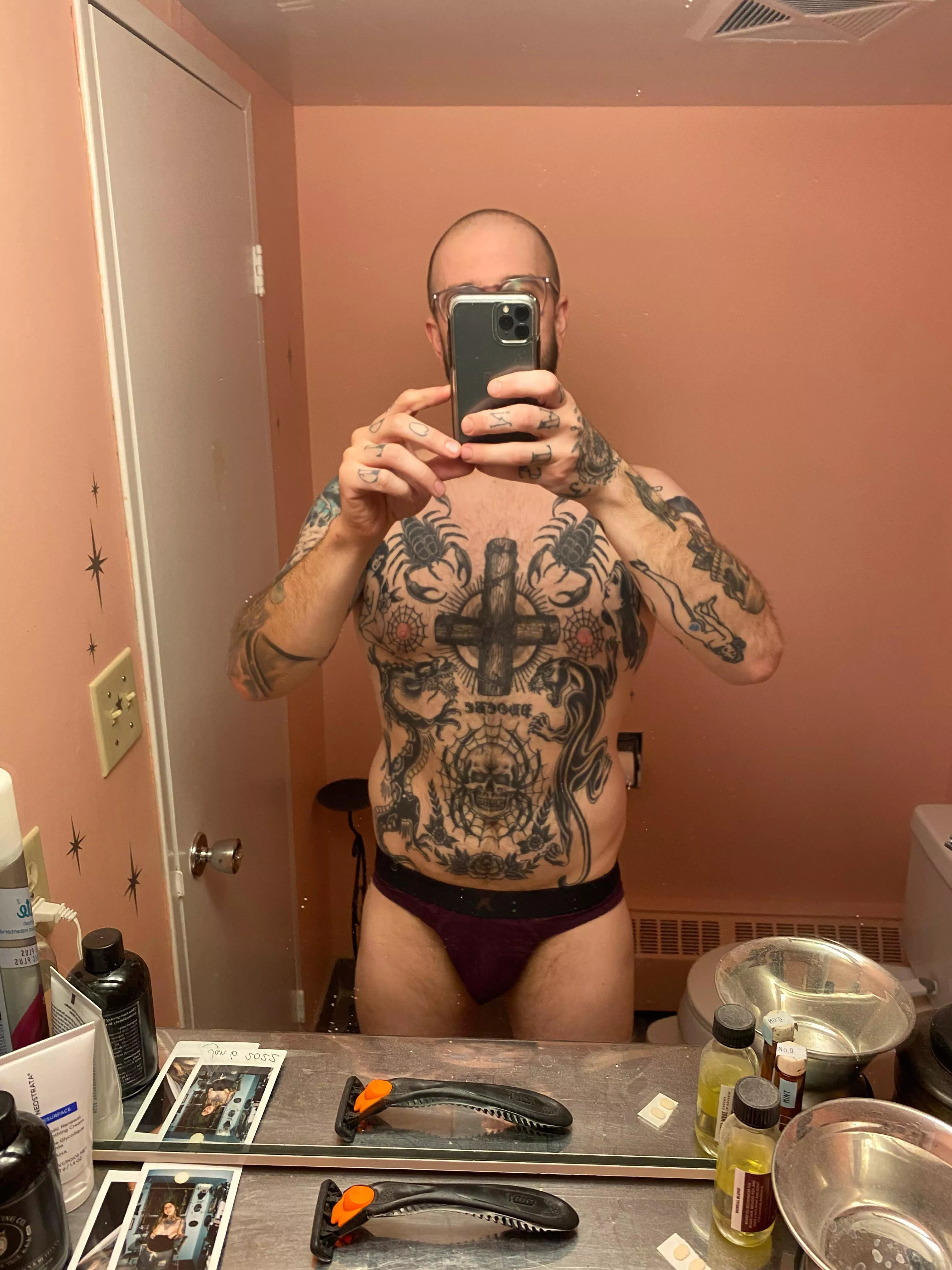 Large tattooed man in a Fenty thong