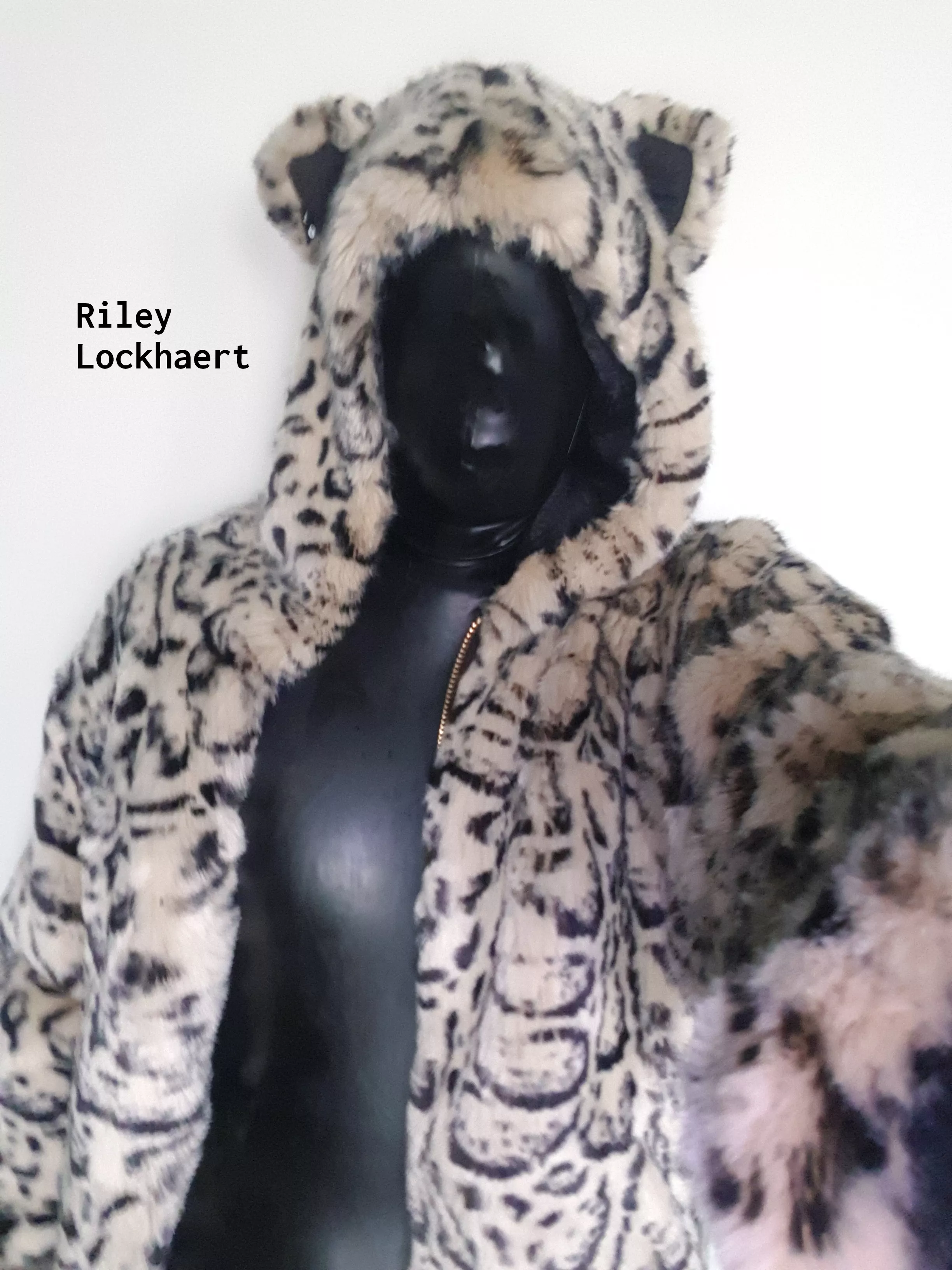 Latex suit with micro-perforated hood under fur bomber